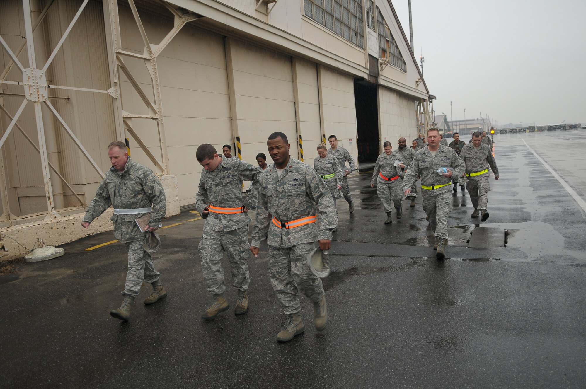 YOKOTA AIR BASE, Japan -- Airmen from the 374th Airlift Wing evacuate their primary facility and head to an alternate location during Beverly-Bearcat 09-05, an operational readiness inspection conducte by the Pacific Air Forces Inspector General. (U.S. Air Force photo/Airman 1st Class Sean Martin)