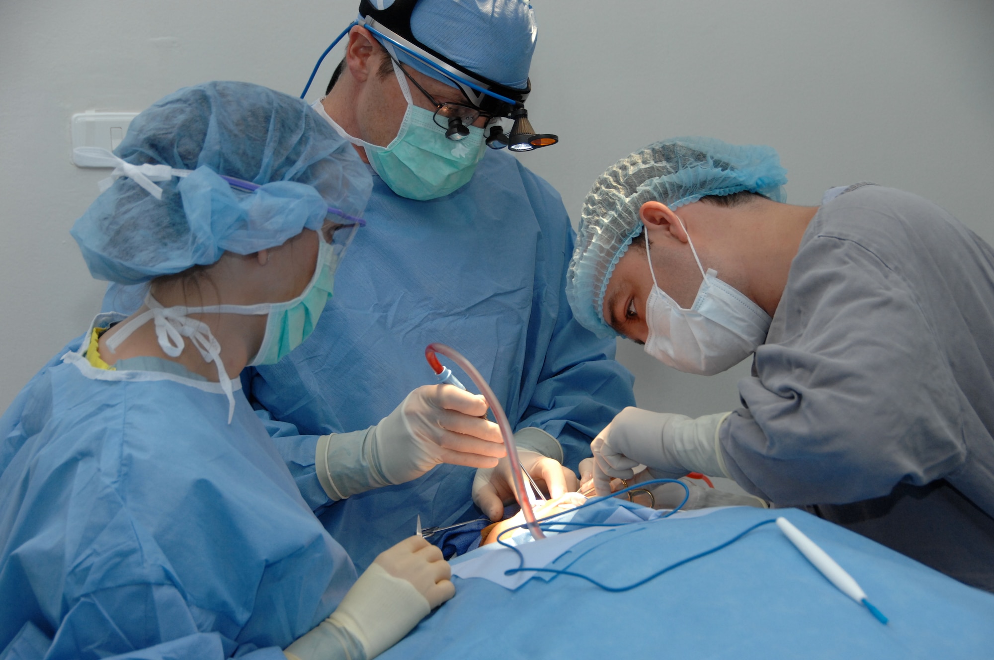 Dr. Matthew Talarczyk (right), performs cleft palate surgery on a Columbian resident with assistance from surgical technician Master Sgt.  Darlena Matthis  on July 22, 2009 in Cartagena, Columbia.  Talarczyk is from the 88th Medical Group, Wright-Patterson Air Force Base, Ohio and Matthis is from the 59th Medical Wing, Lackland AFB, Texas. (U.S. Army photo/Miguel A. Negron)
