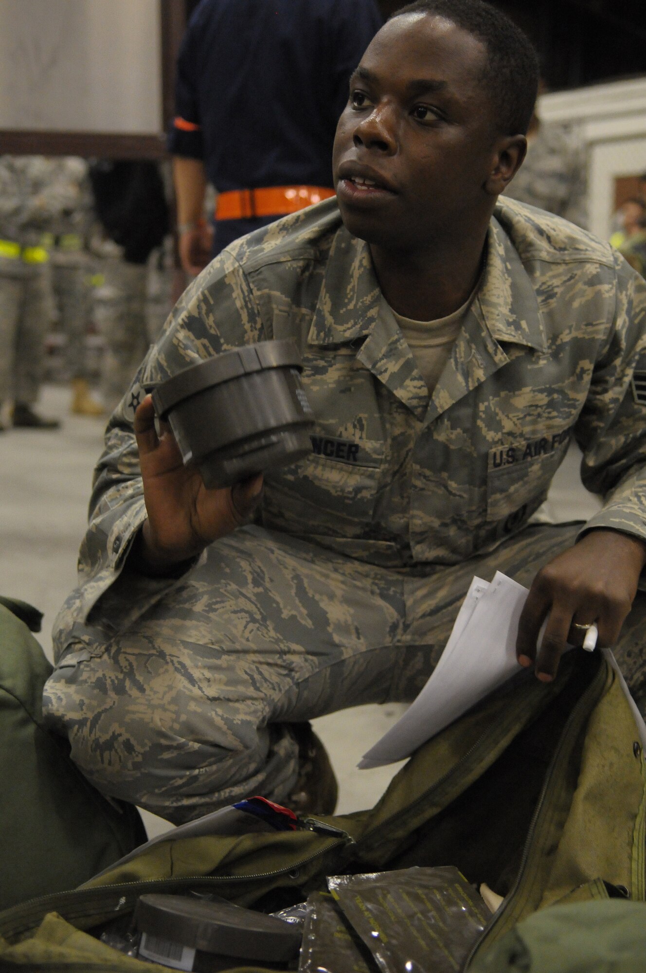 YOKOTA AIR BASE, Japan -- Senior Airman Michael Spencer, 374th Security Forces Squadron, inspects his individual protective equipment during Beverly-Bearcat 09-05, an operational readiness inspection conducte by the Pacific Air Forces Inspector General. (U.S. Air Force photo/Airman 1st Class Michael Dillon)