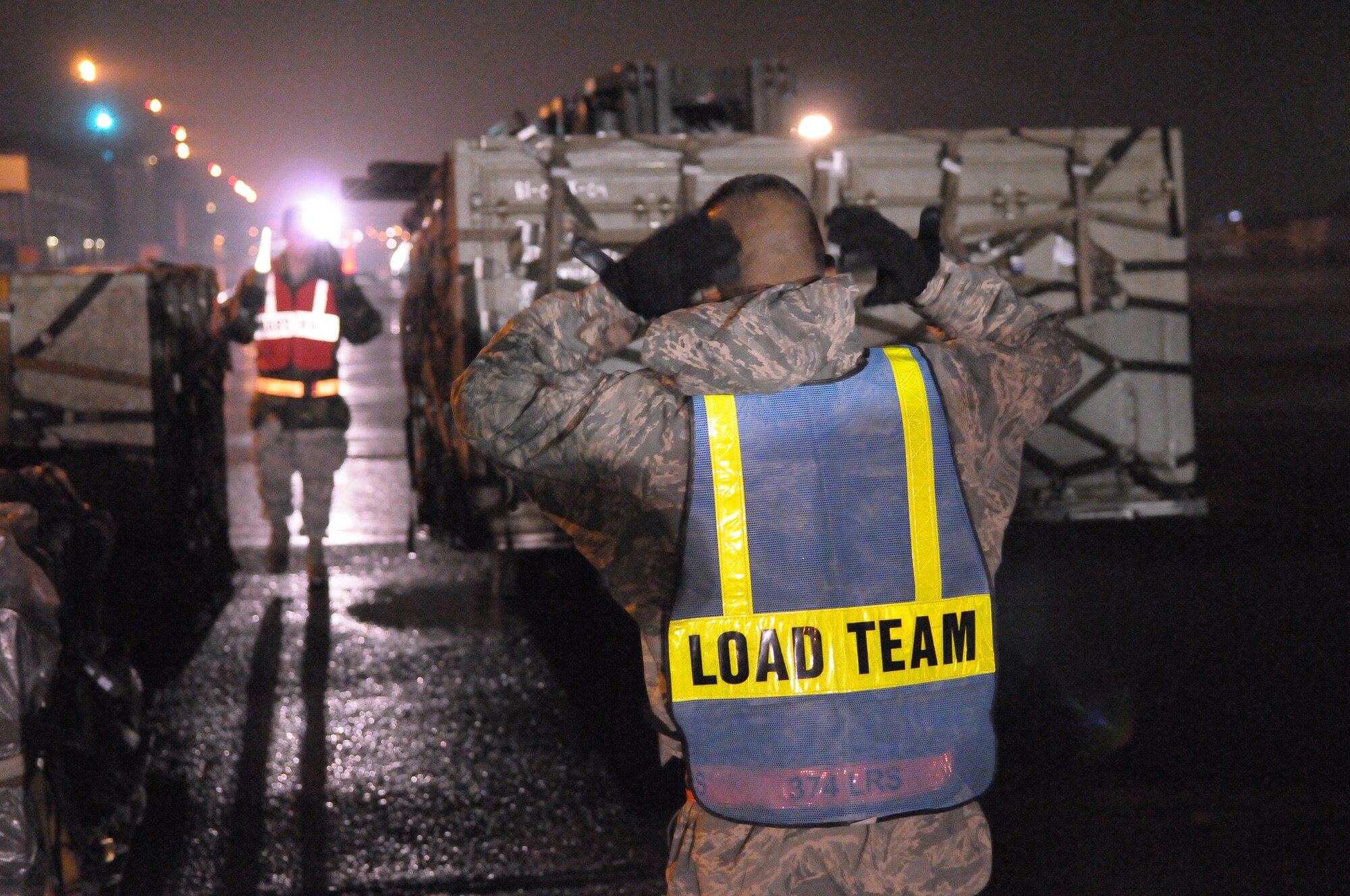 YOKOTA AIR BASE, Japan -- Staff Sgt. Johnson Arana, 374th Logistics Readiness Squadron, guides a forklift carrying supplies during Beverly-Bearcat 09-05, an operational readiness inspection conducte by the Pacific Air Forces Inspector General. (U.S. Air Force photo/Airman 1st Class Michael Dillon)