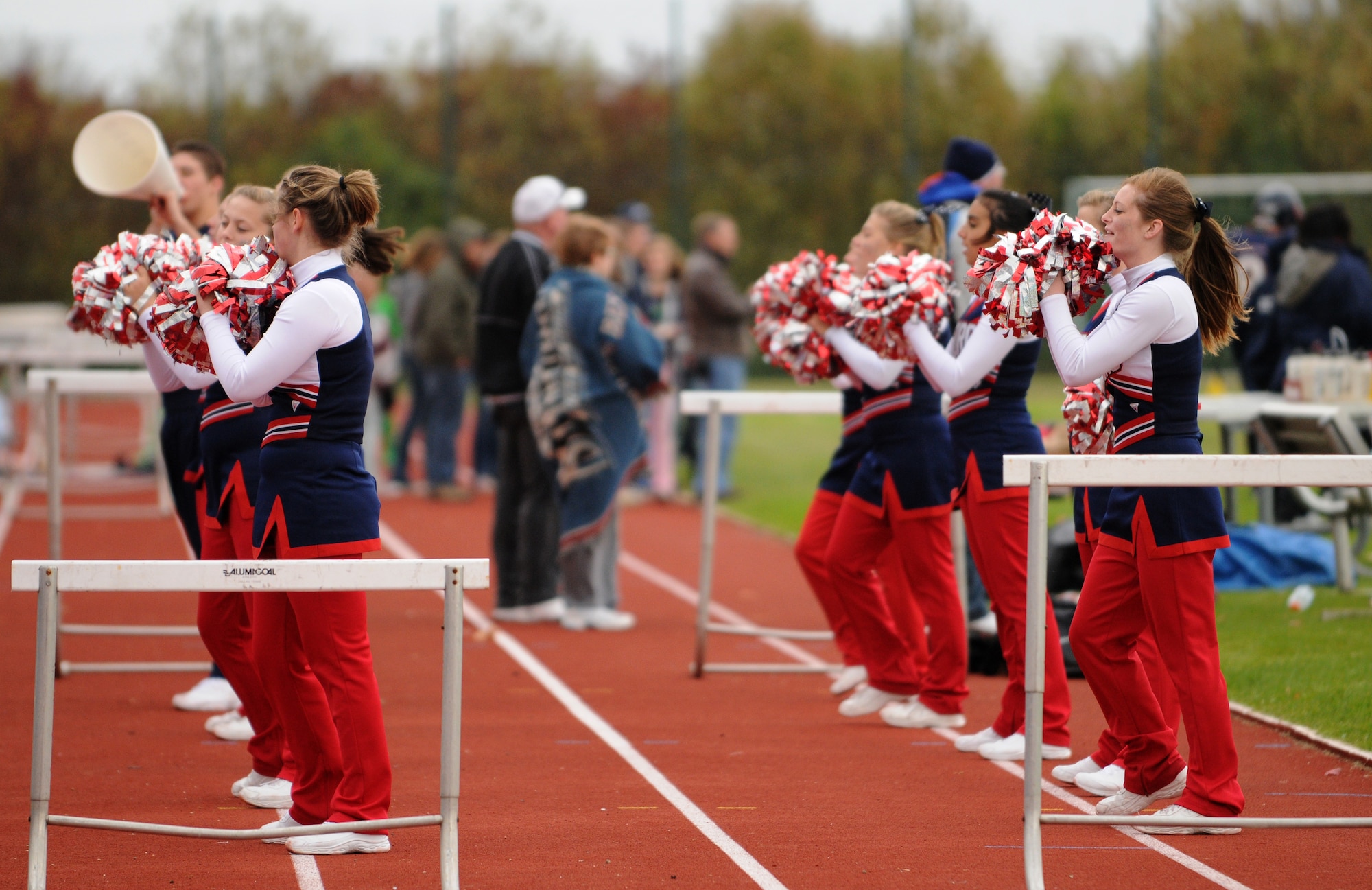 BITBURG ANNEX, Germany -- Members of the Bitburg High School cheer team entertain the crowd Oct. 3 during Bitburg High School’s homecoming game. Fans of the Bitburg Barons showed their support despite the chilly weather at the Bitburg homecoming game. (U.S. Air Force photo/Airman 1st Class Nathanael Callon)