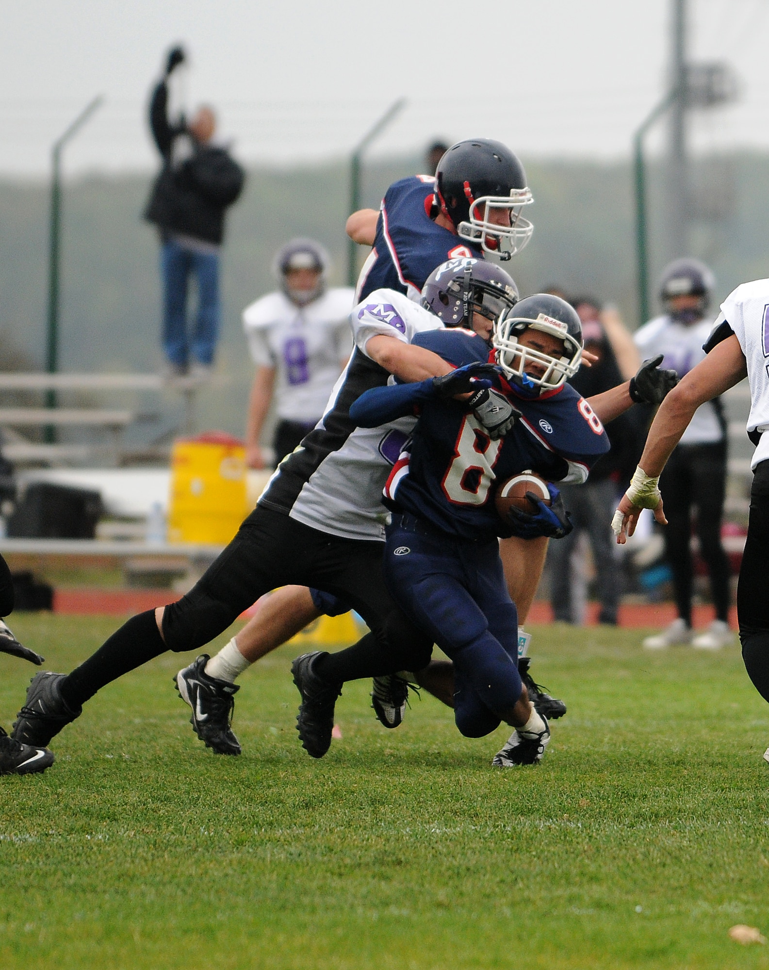 BITBURG ANNEX, Germany -- Bitburg running back Timothy O’Donnell attempts to break free of a Bison defender during the third quarter of the Oct. 3 Bitburg High School homecoming game. The Bitburg Barons defeated the Mannheim Bison 35-0. (U.S. Air Force photo/Airman 1st Class Nathanael Callon)