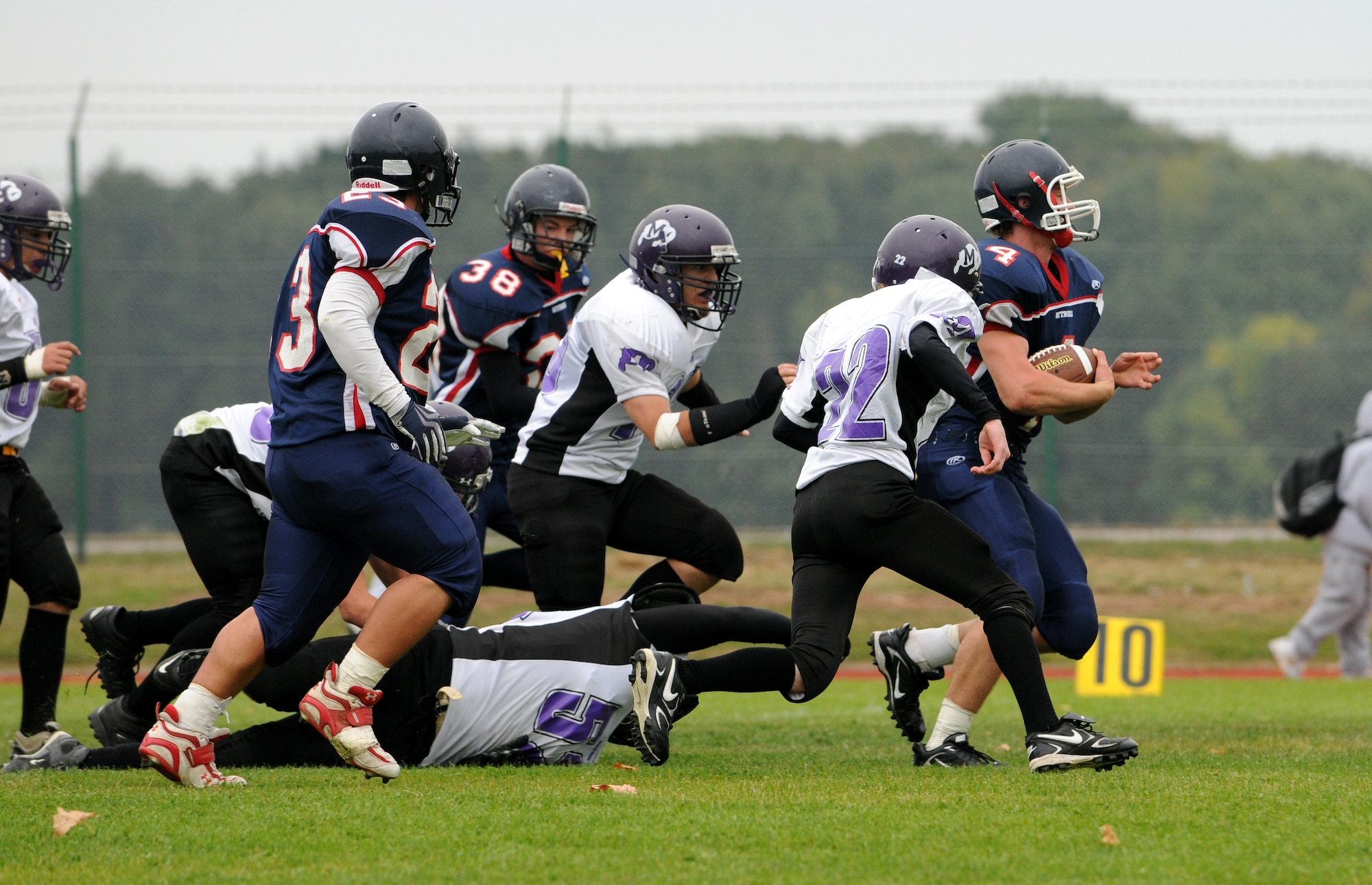 BITBURG ANNEX, Germany -- Bitburg running back Derek Waters rushes past the Mannheim Bison defense during the 1st quarter Oct. 3 during Bitburg High School’s homecoming game. The Bitburg Barons defeated the Bison 35-0. (U.S. Air Force photo/Airman 1st Class Nathanael Callon)