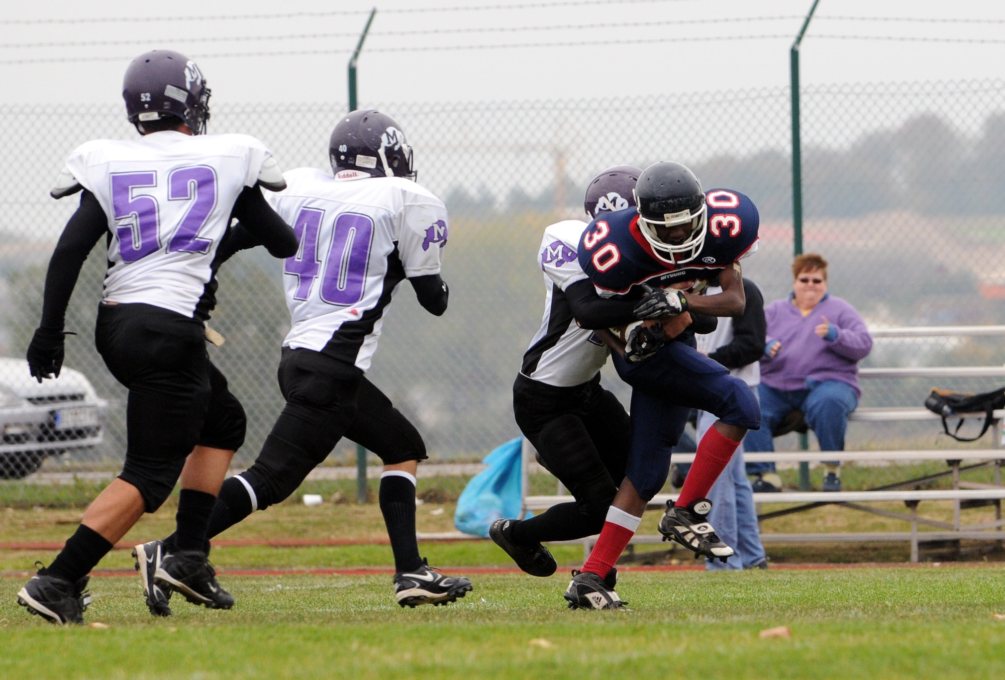 BITBURG ANNEX, Germany -- Bitburg wide receiver Isaiah Salazar attempts to run the ball up the field after catching it during the first quarter of the Oct. 3 Bitburg High School homecoming game. The Bitburg Barons defeated the Mannheim Bison 35-0. (U.S. Air Force photo/Airman 1st Class Nathanael Callon)
