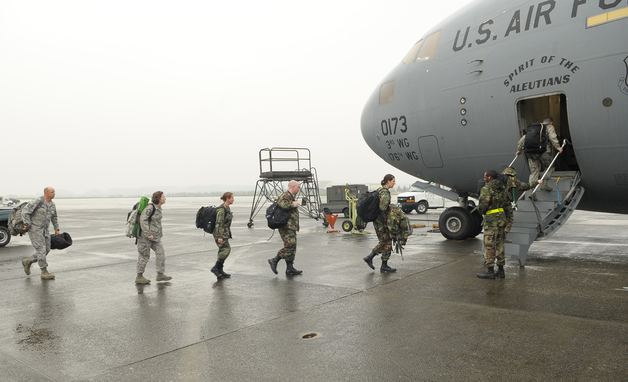 YOKOTA AIR BASE, Japan -- Twenty-six members of an Air Force Humanitarian Assistance Rapid Response Team and a seven-person mobile field surgical team left here at 3:30 p.m. Oct. 5 en route to Padang, Indonesia, to provide medical care to those affected by the recent 7.6-magnitude earthquake. A C-17 Globemaster III crew from Elmendorf Air Base, Alaska, transported the team and 13 pallets of equipment necessary to support the team, which is self-sustaining for up to five days. (U.S. Air Force photo/Airman 1st Class Sean Martin)