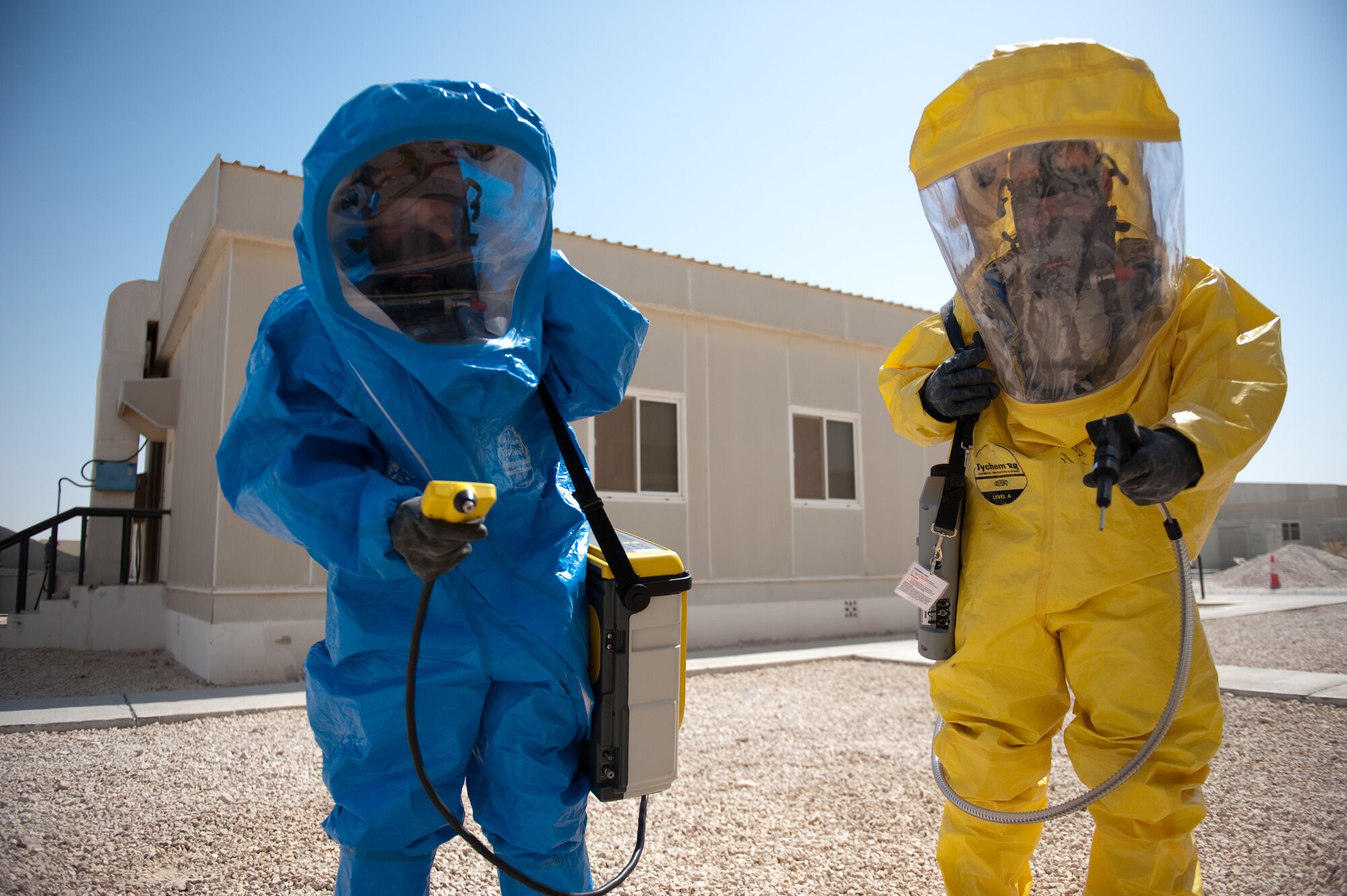 Left, U.S. Air Force Tech. Sgt. Jeremy Roberts and Senior Airman John Matlock, both with the 379th Expeditionary Medical Group Bioenvironmental Engineer flight, conduct a site survey to determine the presence of chemical agents during a training scenario, Oct. 2, in Southwest Asia. The 379 EMDG BEEs provide timely and accurate; health risk assessments, CBRN response, and workplace safety. Sergeant Roberts is deployed from Wright-Patterson Air Force Base, Ohio, and Airman Matlock is deployed from Lackland Air Force Base, Texas, in support of Operations Iraqi and Enduring Freedom. (U.S. Air Force photo/Staff Sgt. Robert Barney/RELEASED) 