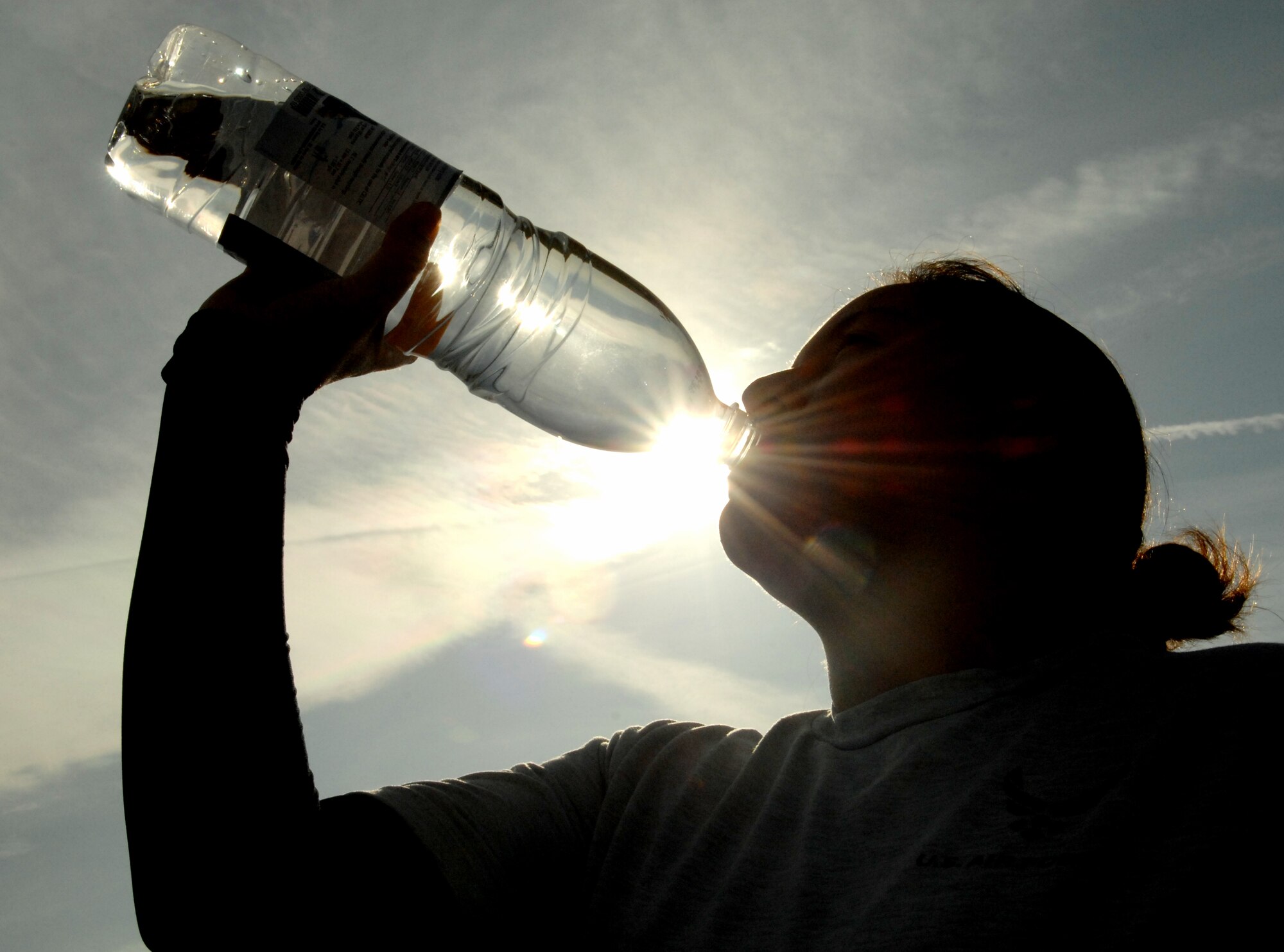 SPANGDAHLEM AIR BASE, Germany – Staff Sgt. Maria Alvarado, 52 Medical Operations Squadron, takes a break to rehydrate during a 24 hour run/walk to raise money for Operation Warmheart here Oct. 2. People participating in the run raised money through pledges for Operation Warmheart, which benefits Spangdahlem Airmen in times of financial need. (U.S. Air Force photo/Senior Airman Benjamin Wilson)