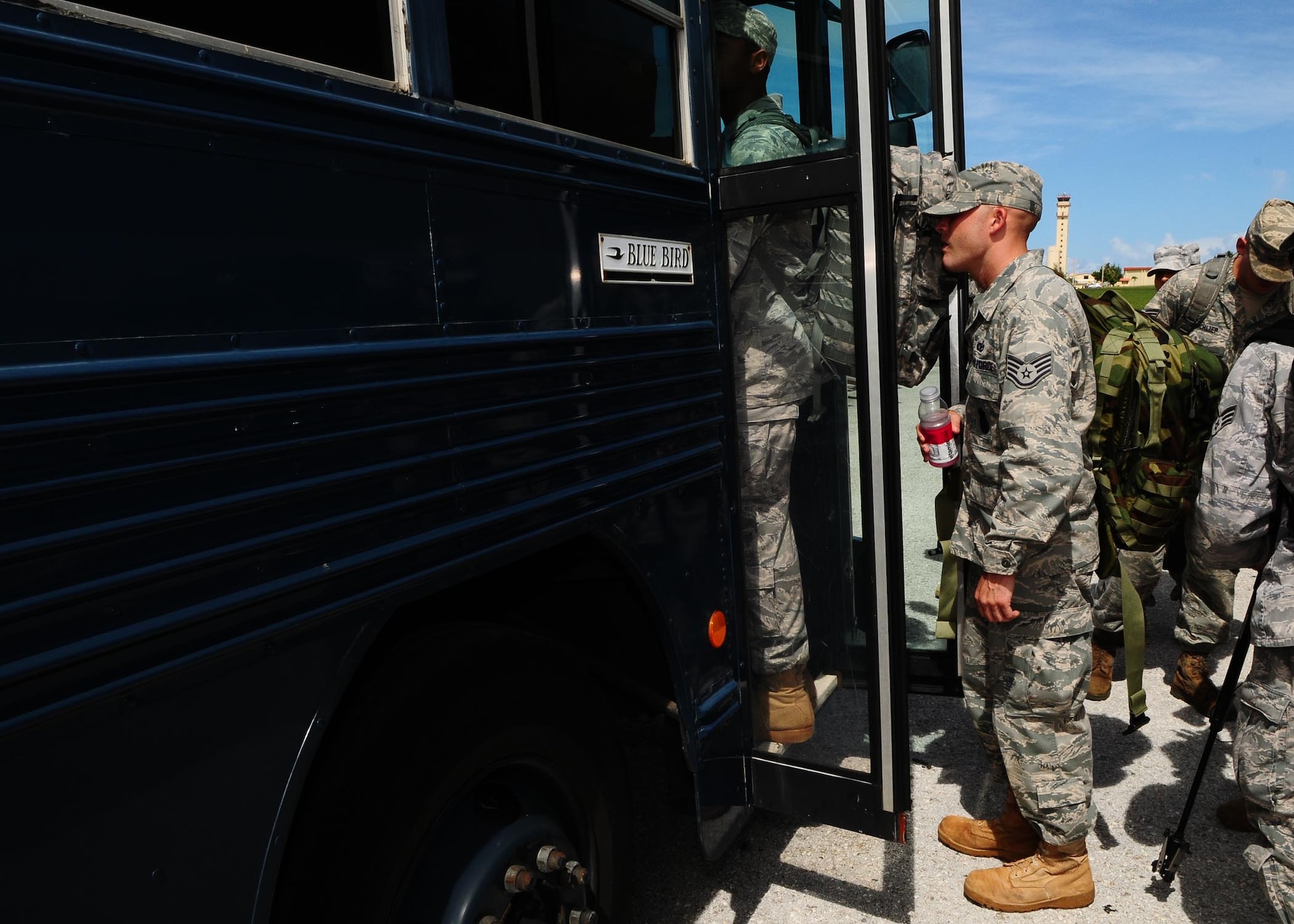ANDERSEN AIR FORCE BASE, Guam-- Members of a Humanitarian Assistance Rapid Response Team (HARRT) board a bus in route to the mobility deployment processing center here Oct. 5 before departing to Padang, Indonesia, to provide disaster relief after a 7.6 magnitude earthquake struck the area Sept. 30. The HARRT is made up of members from the 36th Contingency Response Group and the 36th Medial Group at Andersen AFB.  (U.S. Air Force photo by Senior Airman Nichelle Anderson/Released)

