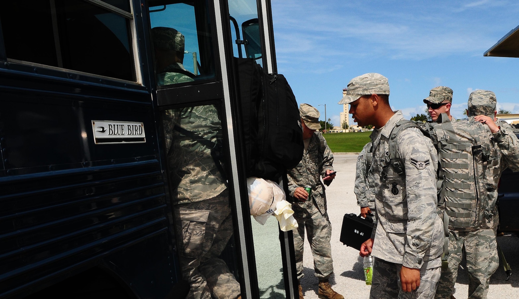 ANDERSEN AIR FORCE BASE, Guam-- Members of a Humanitarian Assistance Rapid Response Team (HARRT) board a bus in route to the mobility deployment processing center here Oct. 5 before departing to Padang, Indonesia, to provide disaster relief after a 7.6 magnitude earthquake struck the area Sep 30. The HARRT is made up of members from the 36th Contingency Response Group and the 36th Medial Group at Andersen AFB.  (U.S. Air Force photo by Senior Airman Nichelle Anderson/Released)
