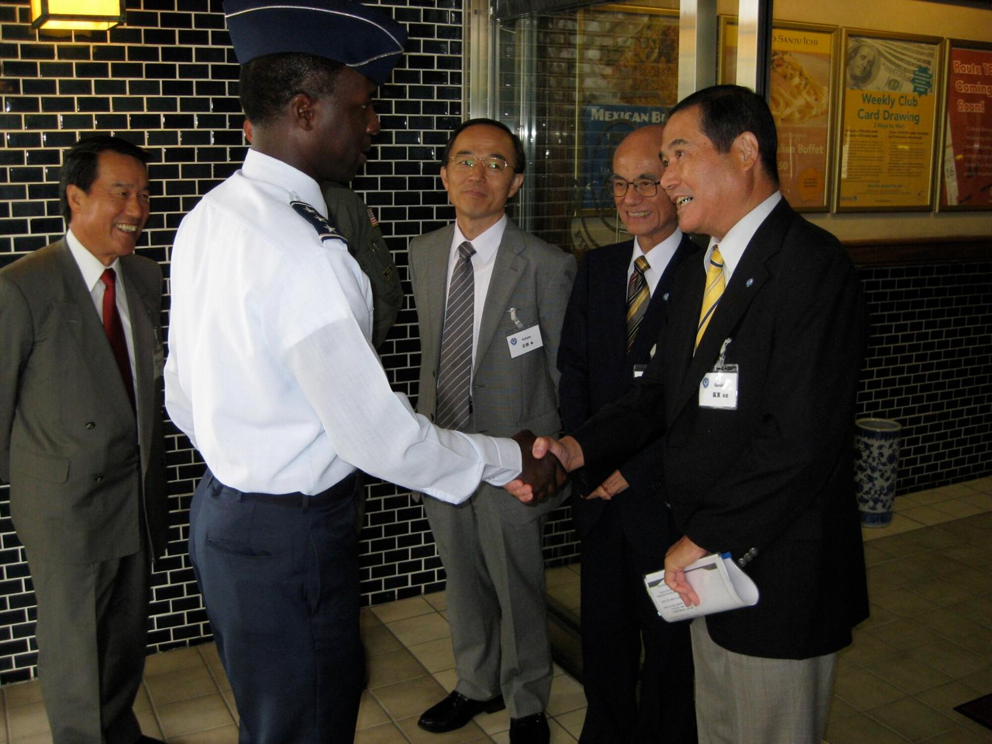 Lt. Gen. Edward Rice, 5th Air Force and U.S. Forces Japan commander, greets Masanori Bando, a retired Japan Air Self-Defense Force colonel and current executive manager of the Japan-America Air Force Goodwill Association, at the Yokota Officer's Club Sept. 30.  The organization is a counterpart of 5th Air Force, and the group promotes friendship and mutual understanding between JASDF and the Air Force.  (U.S. Air Force photo by Capt. Will Powell)