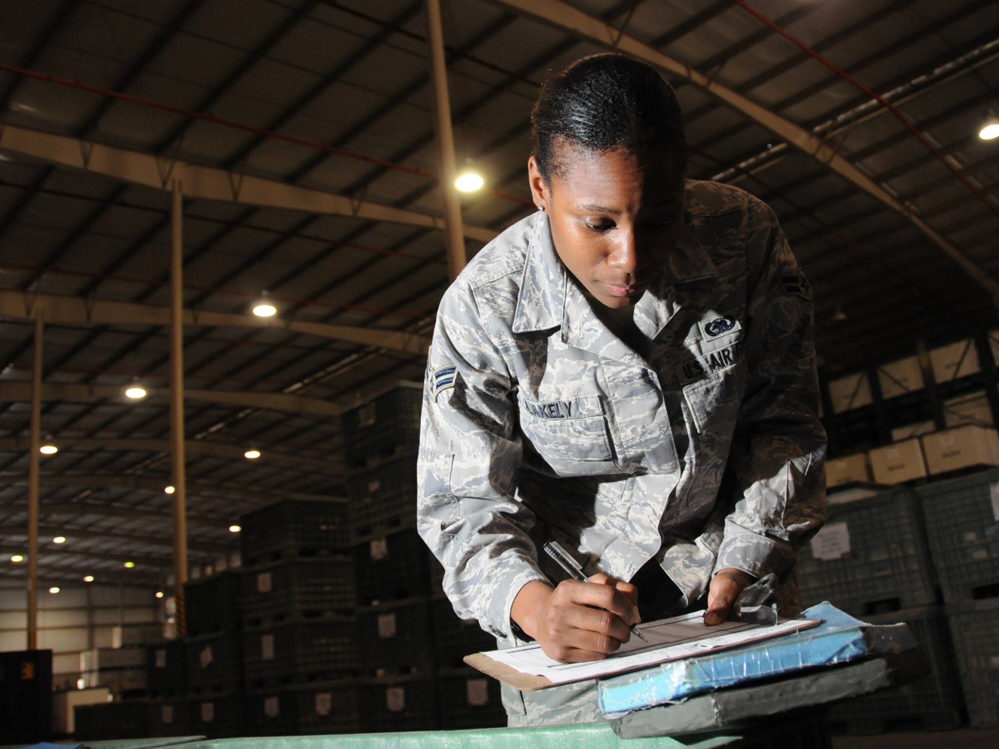 Airman 1st Class Lateshia Blakely, 379th Expeditionary Logistics Readiness Squadron readiness technician takes inventory of individual body armor plates in storage at the expeditionary theater distribution center warehouse, Oct. 1.The ETDC warehouse stores mobility equipment to be issued to transient personnel as the deploy to forward bases. Airman Blakely is deployed from Dover Air Force Base, Del. in support of Operations Iraqi and Enduring Freedom. (U.S. Air Force Photo/Tech. Sgt. Jason W. Edwards)
