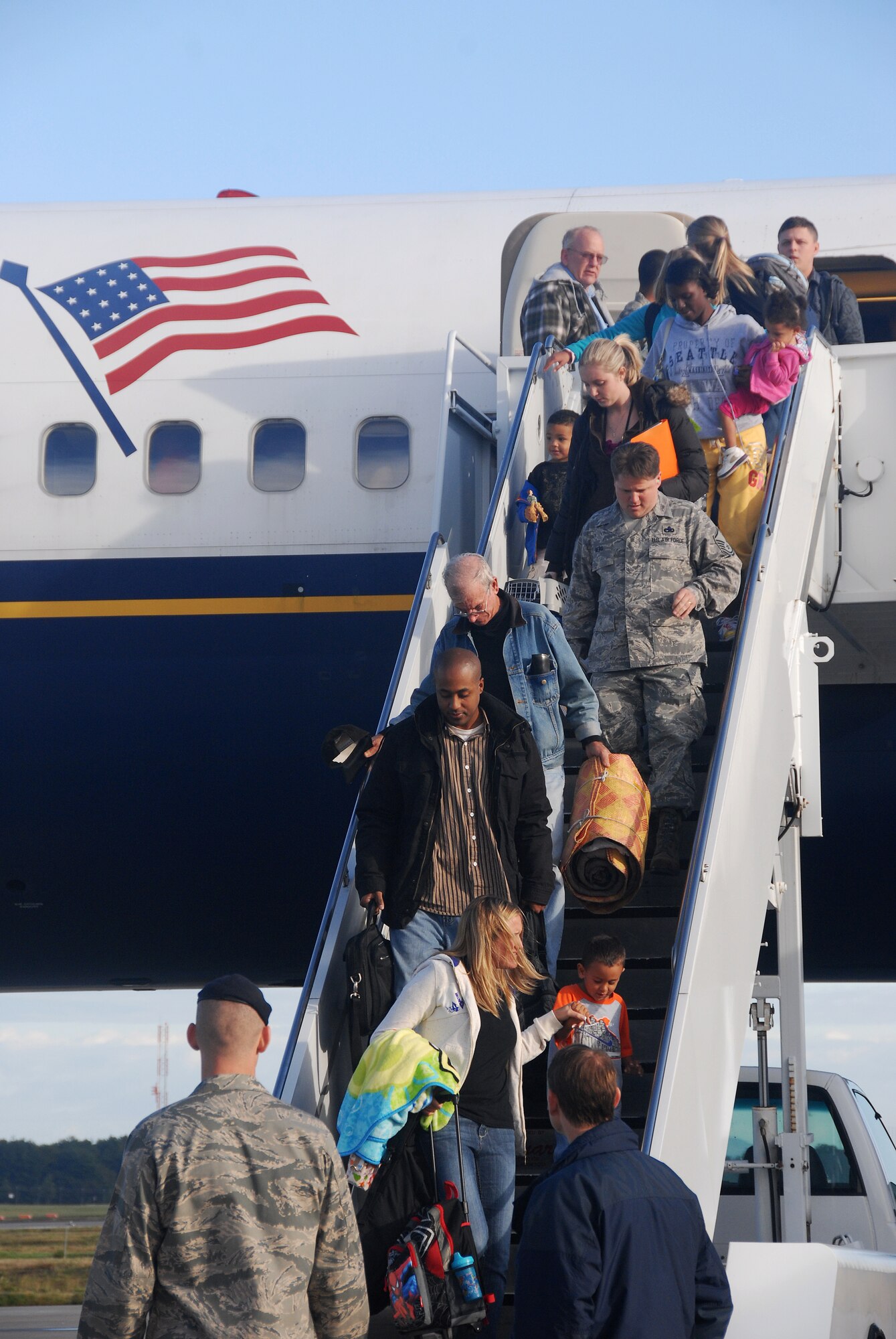 MISAWA AIR BASE, Japan – Passengers exit from the first Patriot Express flight that arrived at Misawa Air Base Oct. 5. The contracted flight is used for official travel to and from Japan but Space Available travel may be an option as well. The AMC Passenger Terminal holds monthly Space-A briefings the last Friday of the month at 4 p.m. in the Passenger Terminal, Bldg. 943. These briefings cover the requirements for using the Space-A system to travel on AMC aircraft. (U.S. Air Force photo/Senior Airman Stefanie Torres)