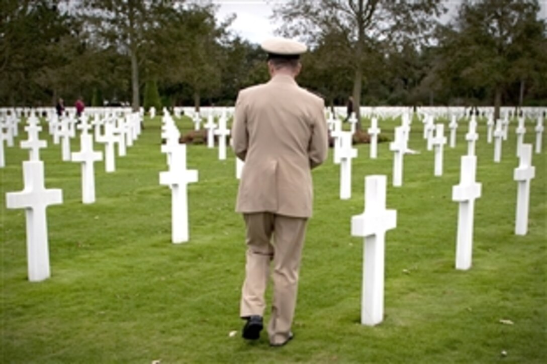 U.S. Navy Adm. Mike Mullen, chairman of the Joint Chiefs of Staff, lays a wreath at the Normandy American Cemetery and Memorial, Colleville-sur-Mer, Normandy, France, Oct. 4, 2009. The grounds hold 9,387 American dead, most of whom lost their lives in the D-Day invasion and subsequent operations.