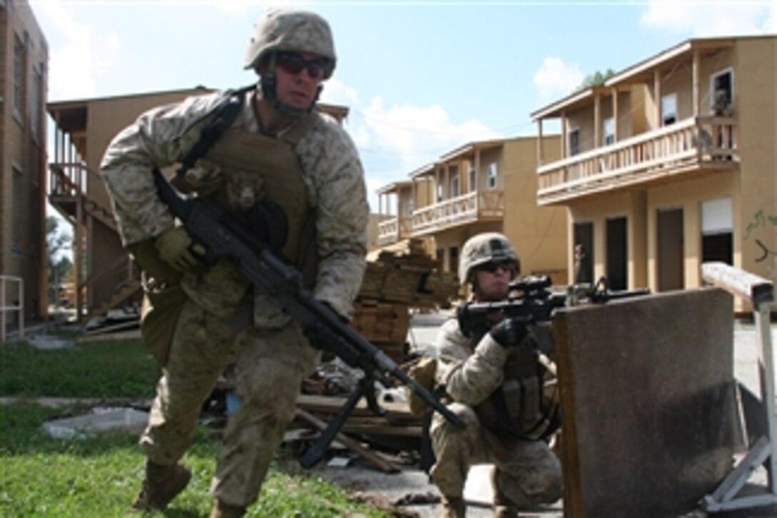 U.S. Marines from Battalion Landing Team 1st Battalion, 9th Marine Regiment, 24th Marine Expeditionary Unit perform counterinsurgency training exercises at the Muscatatuck Urban Training Center in Indiana during a 24th Marine Expeditionary Unit realistic urban training exercise on Sept. 27, 2009.  Realistic urban training is a pre-deployment training exercise.  