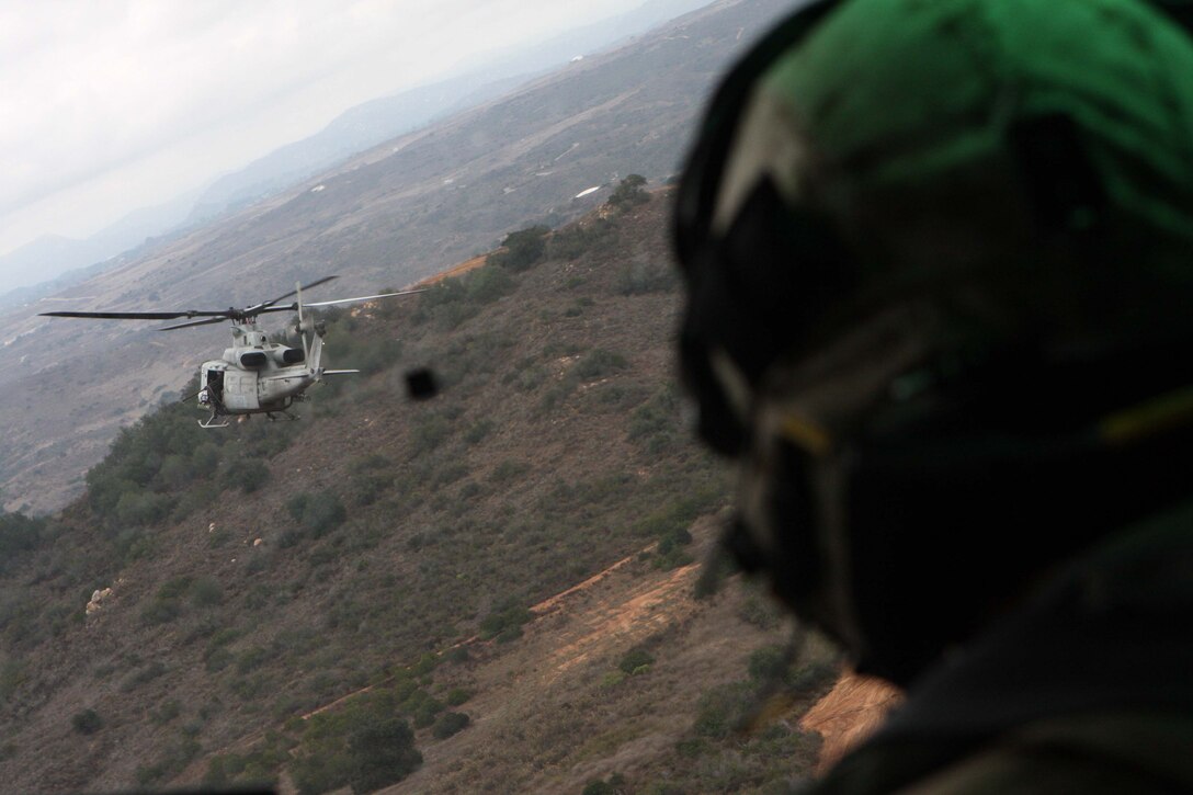 Maj. Louis P. Simon, a UH-1Y Huey pilot with Marine Light Attack Helicopter Squadron 267, follows the lead  Huey over Marine Corps Base Camp Pendleton, Calif., Oct. 20.  The two Hueys practiced manuevers with an AH-1W Cobra for the HMLA-267 Family Day Oct. 23.