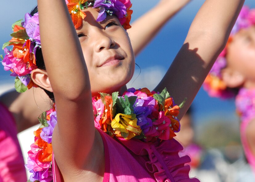 Children from the Halau Hula Olana under the direction of Kumu Hula Olana dance traditional hula dances for the U.S. Air Force Thunderbirds arrival Sept. 16 at Hickam Air Force Base, Hawaii. They met the pilots with leis to put around their necks to welcome them. The lei in the Hawaiian culture symbolizes many things, to include welcome and affection for the person receiving it. In 1975, Howard and Olana A`i established Halau Hula Olana, the School of Living Hula, where hundreds of children ages 6-13 have been instructed by Olana and her family. The halau frequently performs in Hawai`i, and has danced in Europe, Asia, the South Pacific, and across the United States. (U.S Air Force photo/Staff Sgt. Mike Meares)