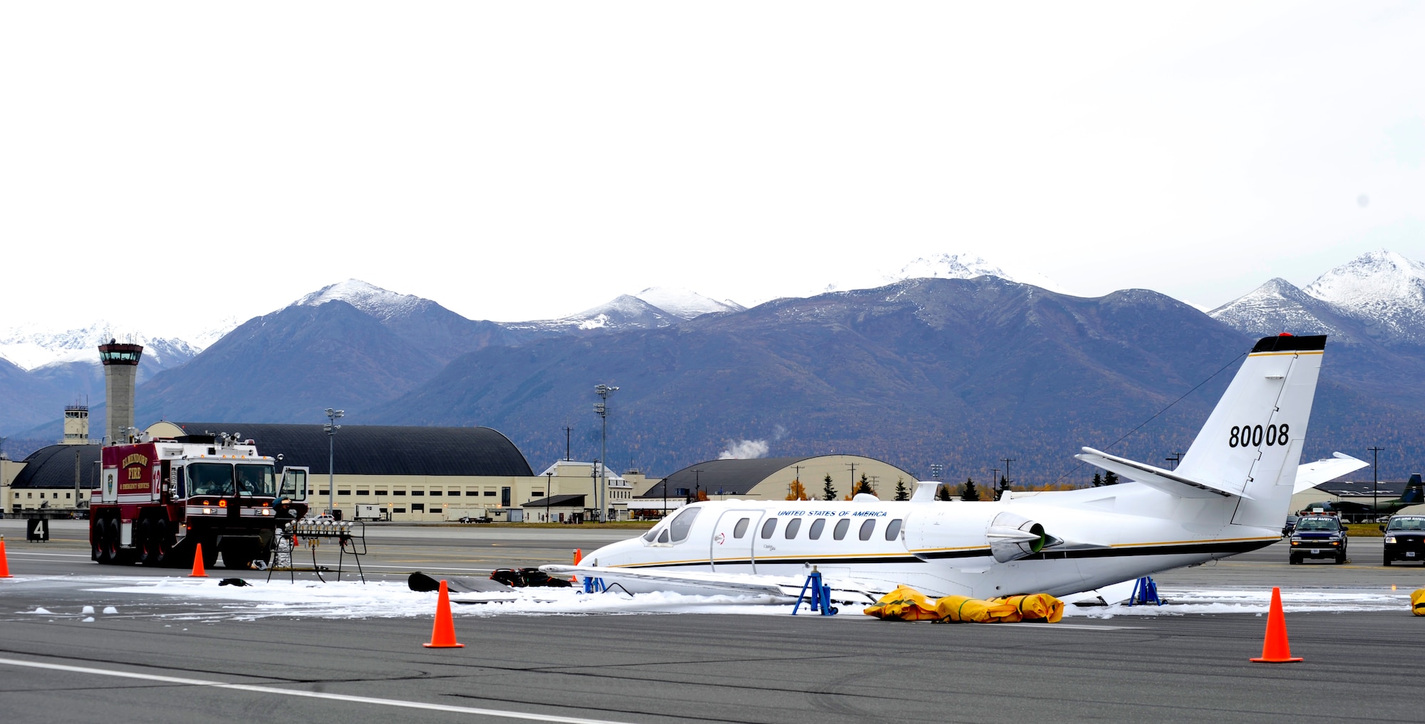 ELMENDORF AIR FORCE BASE, Alaska-- An Army Citation-560 aircraft was forced to perform a gear-up landing at the Elmendorf airfield at 3:24 p.m. Oct. 6, 2009. Emergency response personnel quickly arrived at the scene. Three people were on board; no one was injured in the accident. An investigation will determine the cause of the accident.  (U.S. Air Force photo/ Senior Airman Matt Coleman-Foster)