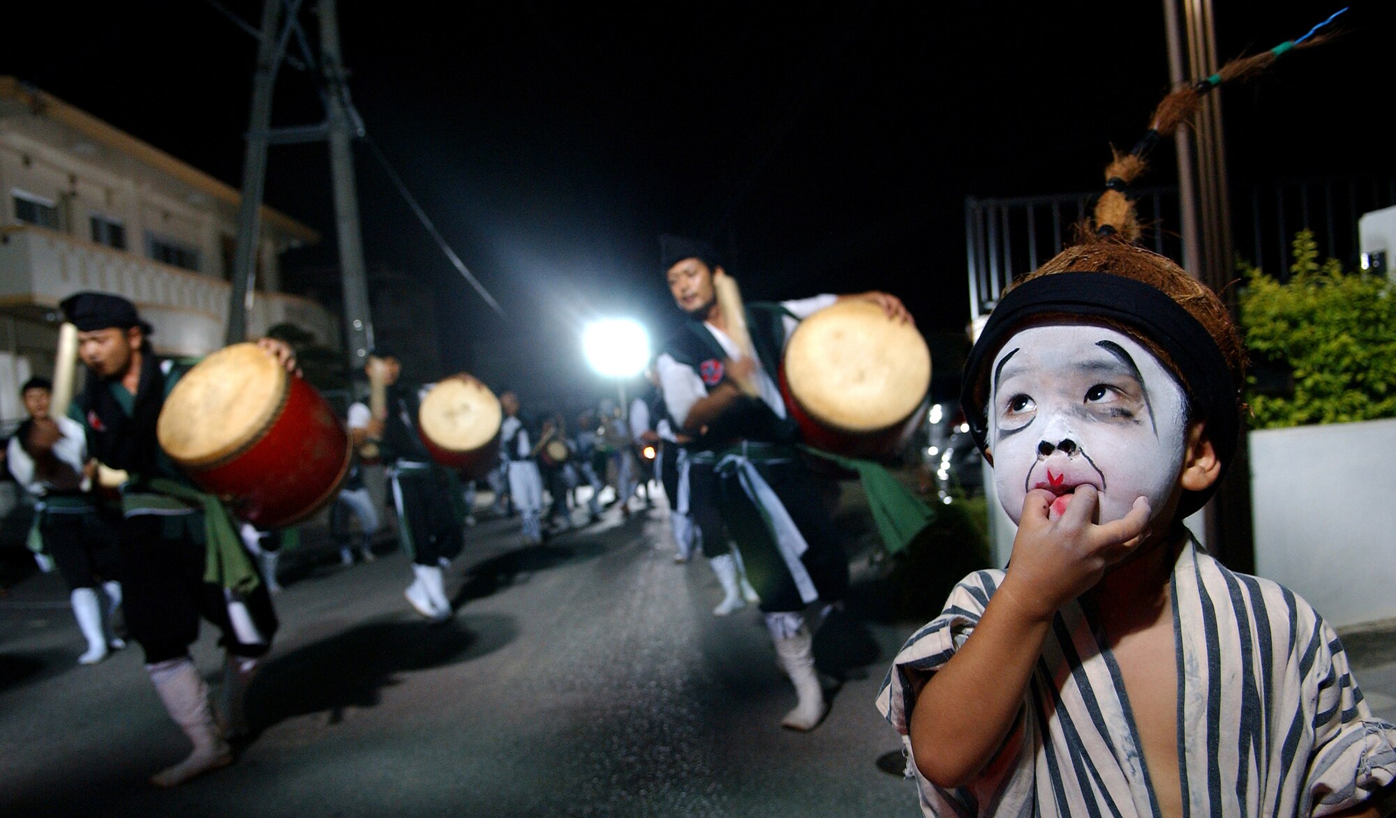A young Okinawan child participates in an Obon dance or "Eisa" at Kadena Air Base. Japan. Throughout Obon, there will be Eisa dancers and family celebration late into the evening.
(U.S. Air Force photo/Tech. Sgt. Rey Ramon)    
                                                  