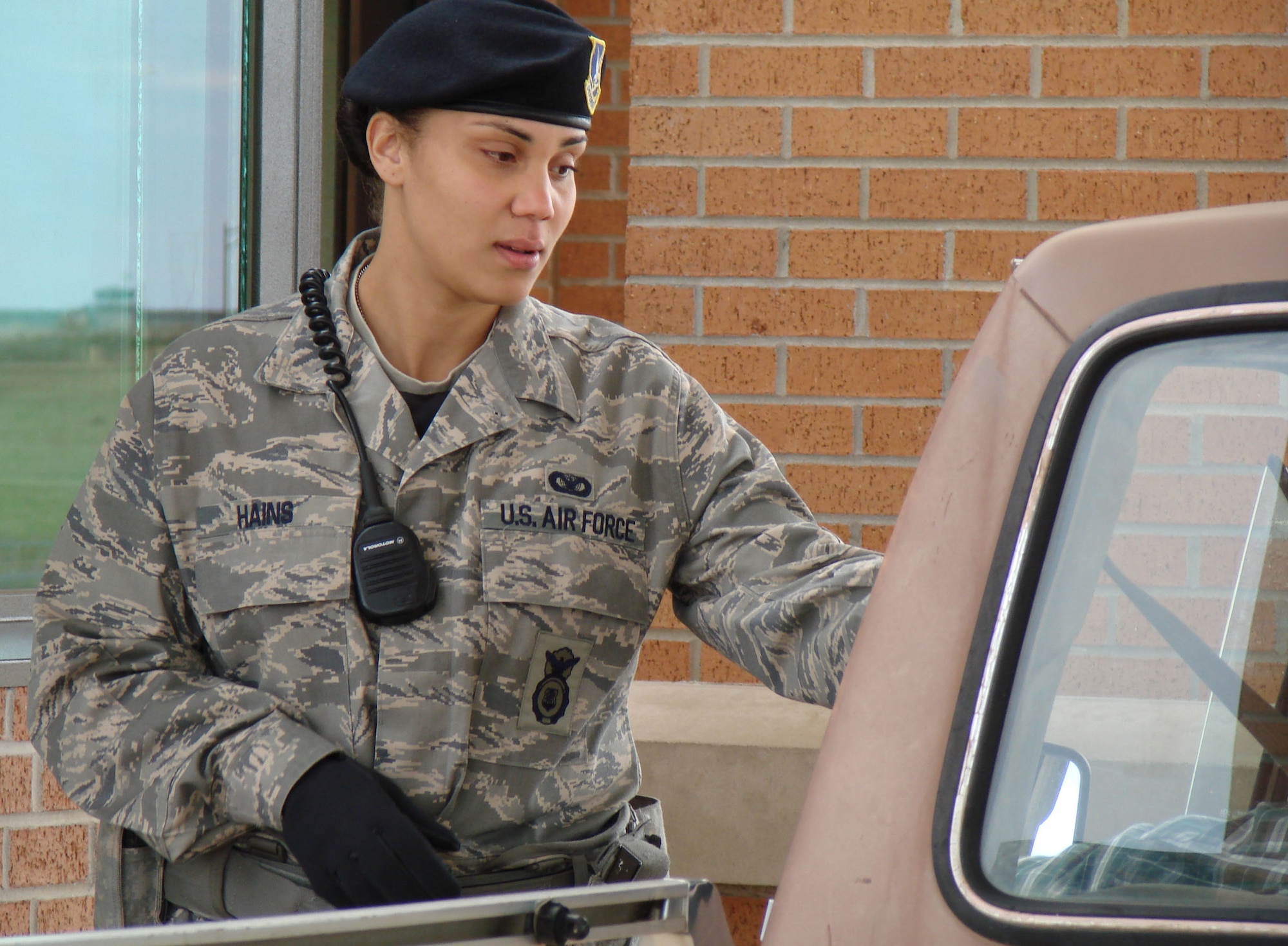 Airman Tynisia Hains checks the driver for identification at Vance’s main gate. Active duty security forces and Department of the Air Force police are once again manning the gates here, which has been a job for civilian contractors since 2002.