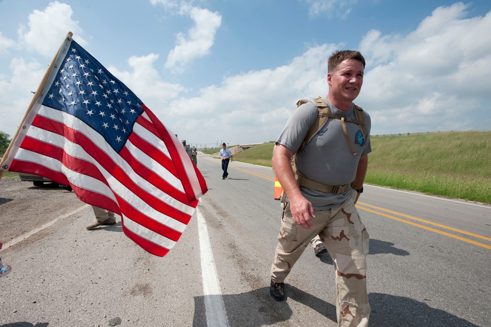 Chief Master Sgt. Tony Travis, a combat controller with the 23rd Special Tactics Squadron at Hurlburt Field, Fla., walks along I-10 near mile marker 587 in Texas. He is participating in the Special Tactics Memorial Ruck to raise awareness and support for the Special Operations Warrior Foundation and recognize fallen comrades of wars in Iraq and Afghanistan. Six, two-man teams will complete their mission in 10 days by walking 10-15 mile legs around the clock while carrying a ruck weighing at least 50 pounds, which is traditionally used in all training marches. (U.S. Air Force photo/Steve Thurow)