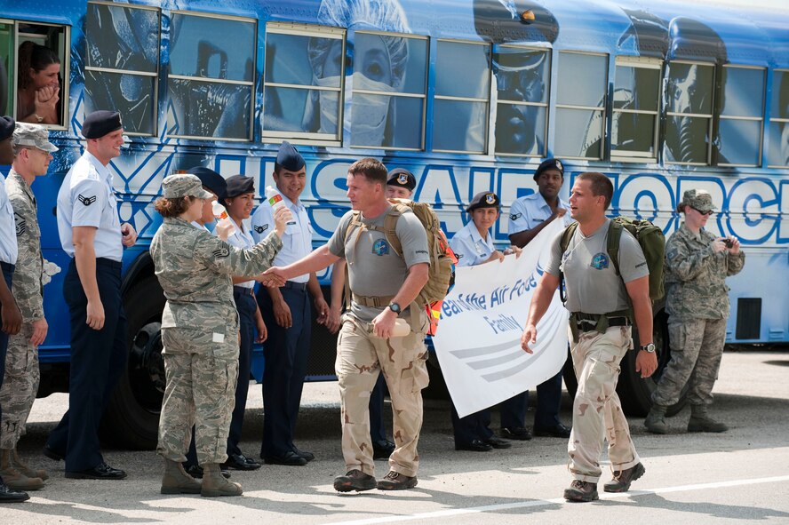 Members of Team Randolph greet Chief Master Sgt. Tony Travis and Tech. Sgt. Chris Grove, combat controllers from the 23rd Special Tactics Squadron at Hurlburt Field, Fla., as they walk along I-10 near mile marker 587 in Texas. The combat controllers are participating in the Special Tactics Memorial Ruck to raise awareness and support for the Special Operations Warrior Foundation and recognize fallen comrades of wars in Iraq and Afghanistan. The six two-man teams will complete their mission in 10 days by walking 10-15 mile legs around the clock while carrying a ruck weighing at least 50 pounds which is traditionally used in all training marches. (U.S. Air Force photo/Steve Thurow)