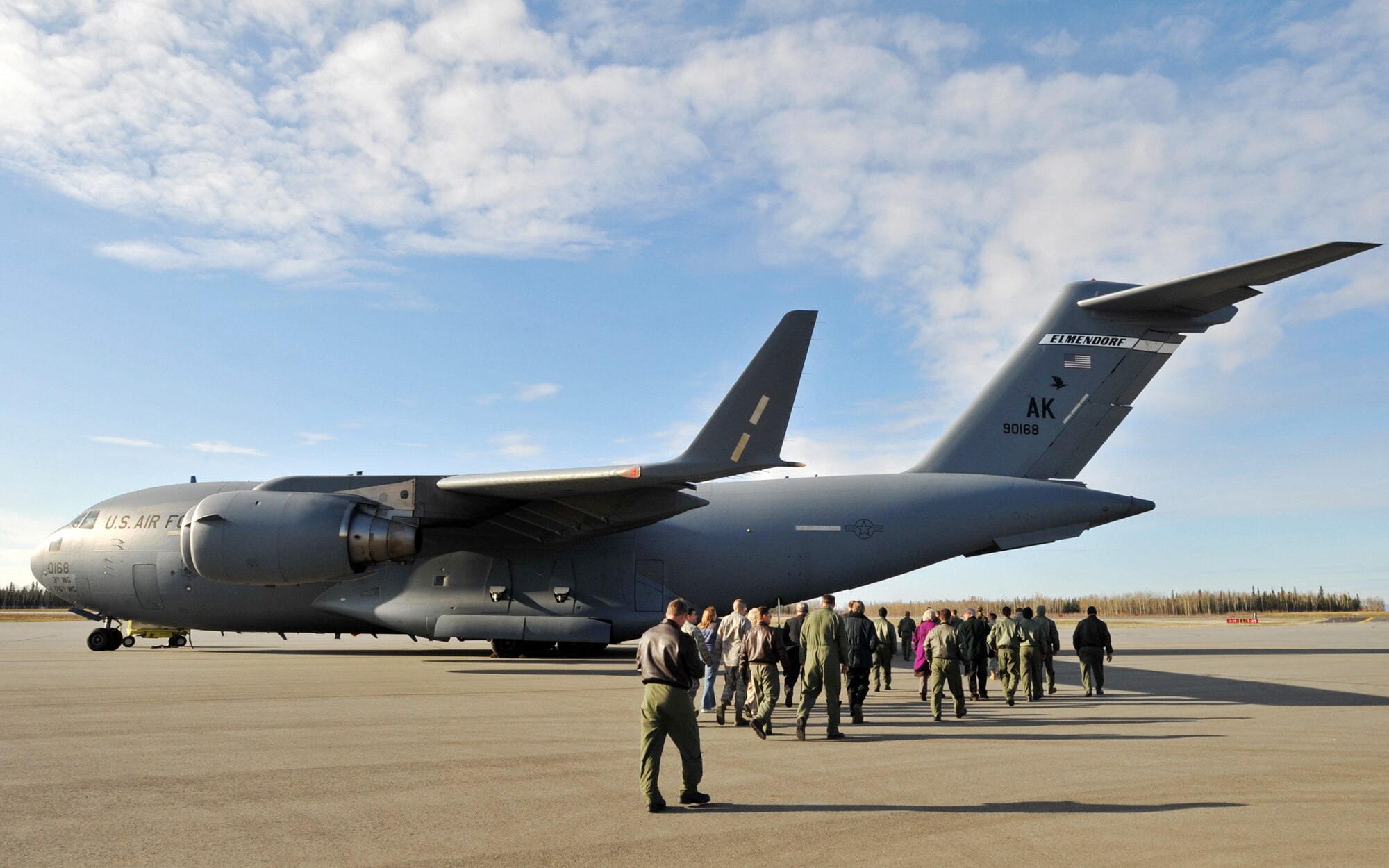 An audience gathered for a ribbon cutting ceremony to view a C-17 Globemaster III from the 517th Airlift Squadron Sept. 29, 2009, at a newly opened runway on Allen Army Airfield, Alaska. (U.S. Air Force photo/Senior Airman Laura Turner) 