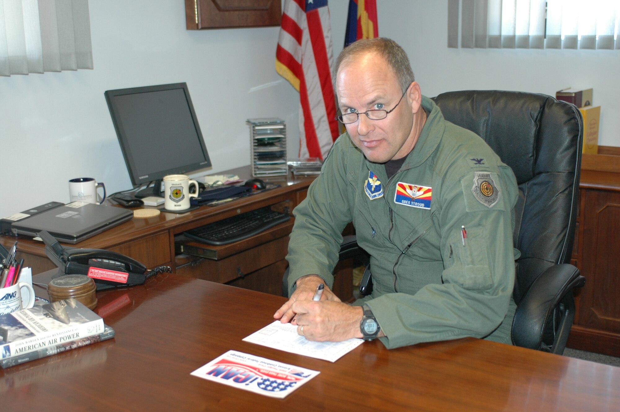 Col. Greg Stroud, 162nd Fighter Wing commander, fills out a Combined Federal Campaign donation form Oct. 2. The wing’s campaign started with the October unit training assembly and will run through Dec. 15. (Air National Guard photo by 2nd Lt. Angela Walz)