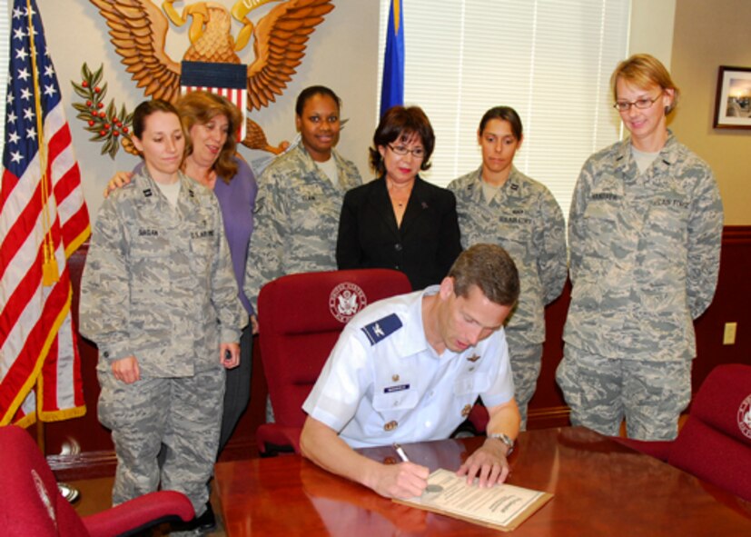 LAUGHLIN AIR FORCE BASE, Texas -- Col. Jeff McDaniels, 47th Flying Training Wing commander, signs a proclamation for Domestic Violence Awareness Month Oct. 2.  Domestic Violence Awareness Month is dedicated to breaking the cycle of violence by providing people with education about healthy relationships, and by changing attitudes that support violence.  The proclamation letter calls upon the base community to take action to make themselves aware of the negative effects of domestic violence and to become actively involved in its prevention.  (U.S. Air Force photo by Jose Mendoza)
