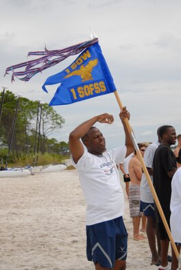 U.S. Air Force Maj. LaMont Coleman, 1st Special Operations Force Support Squadron commander, throws his hands up in defeat after the 1st SOFSS loses to the 1st Special Operations Logistics Readiness Squadron Team #1 in tug-o-war during the H2Olympics at Hurlburt Field, Fla., Oct. 2, 2009. (U.S. Air Force photo by Staff Sgt. Orly N. Tyrell)