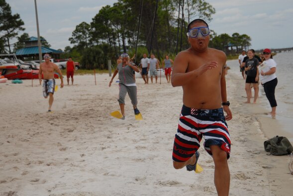 U.S. Air Force Tech. Sgt. Noel Cabell, 1st Special Operations Component Maintenance Squadron, outruns his competitors in the dive flipper relay race during the H2Olympics at Hurlburt Field, Fla., Oct 2., 2009. (U.S. Air Force photo by Staff Sgt. Orly N. Tyrell)