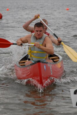 U.S. Air Force Capt. Tim Hellfrich (front) and Maj. Karl Seekamp, 413th Flight Test Squadron, paddle their canoe toward the finsh line in the second leg of the canoe relay race during the H2Olympics at Hurlburt Field, Fla., Oct. 2, 2009. (U.S. Air Force photo by Staff Sgt. Orly N. Tyrell) 
