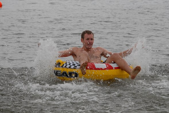 U.S. Air Force 2nd Lt. David McCreedie, 19th Special Operations Squadron, manuvers his inner tube in the first leg of the inner tube relay race during the H2Olympics at Hurlburt Field, Fla., Oct. 2, 2009. (U.S. Air Force photo by Staff Sgt. Orly N. Tyrell)