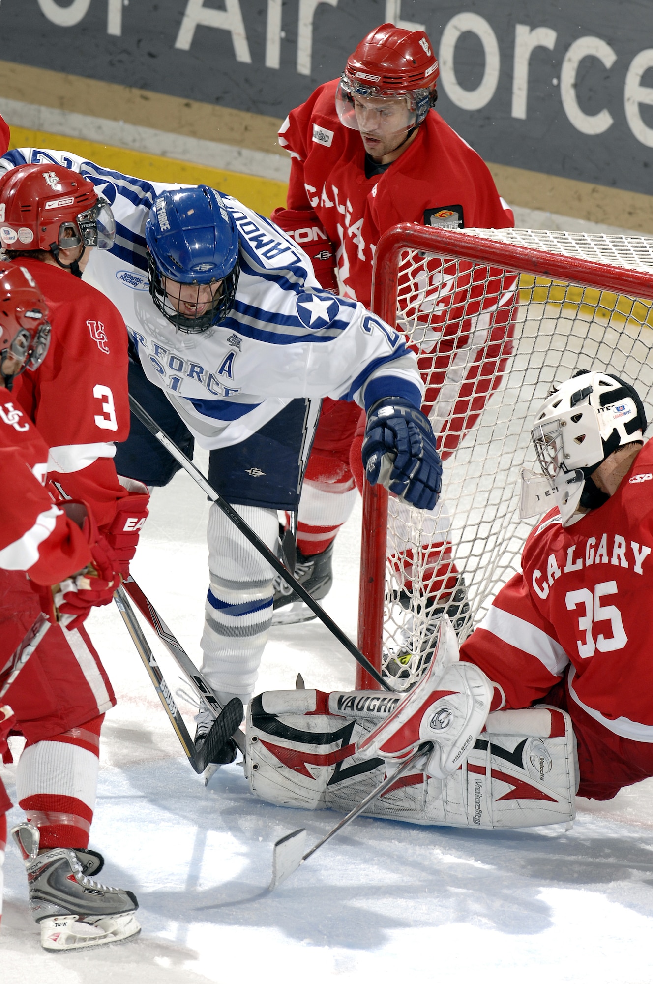 Air Force junior forward Jacques Lamoureux scores one of his two goals against Calgary during the Falcons-Dinos exhibition game at the Cadet Ice Arena Oct. 5, 2009. Air Force won the match 3-1 and will play its first game of the regular season at Bemidji State in Bemidji, Minn., Oct. 9. (U.S. Air Force photo/Mike Kaplan)