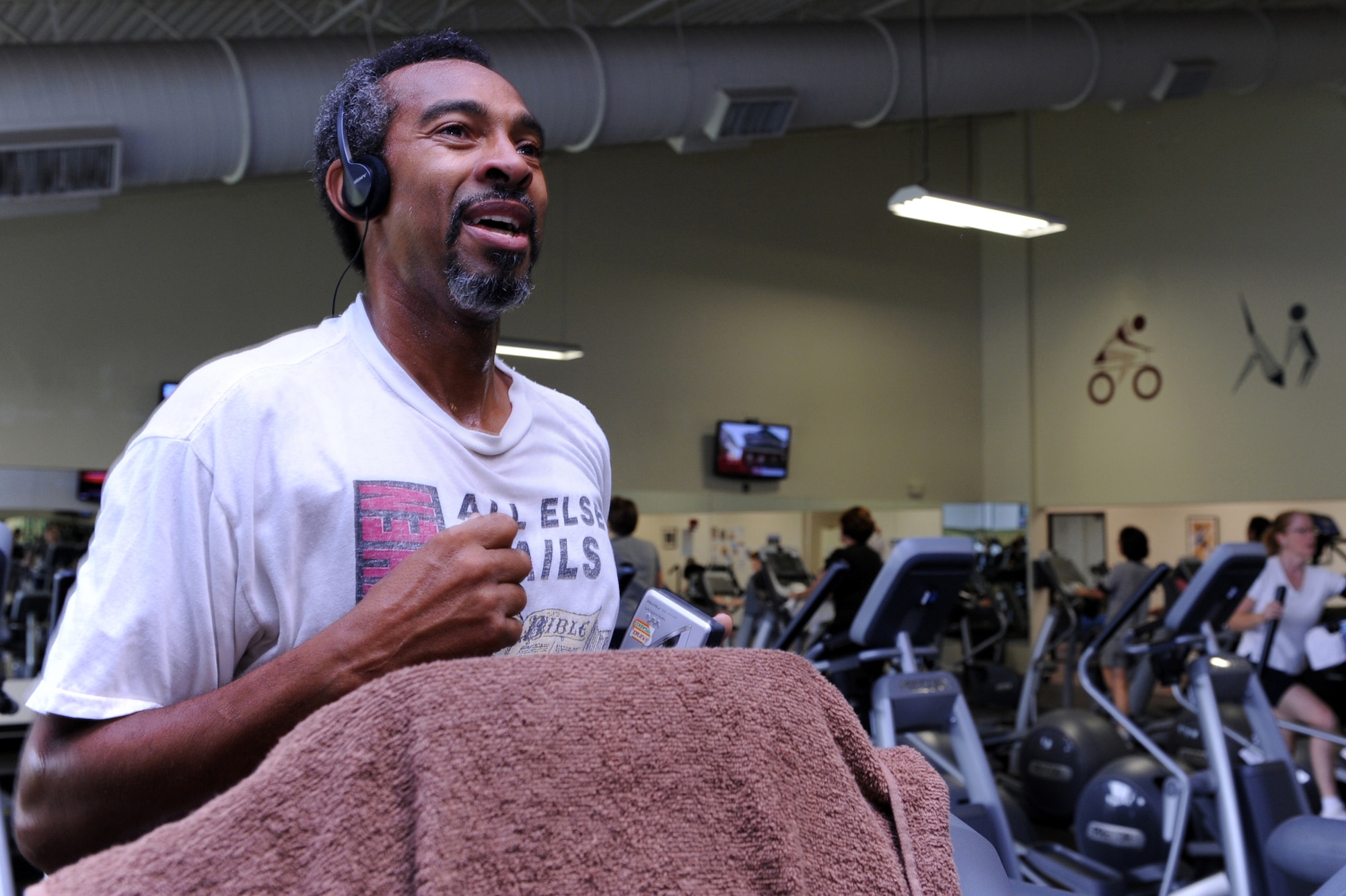 Retired Chief Master Sgt Brian Riddle runs on a treadmill Sept. 15 at the Sports and Fitness Center on base. This is the sixth consecutive year that the fitness center staff has received a 5-star rating due to their constant vigilance and attention to detail while improving the facility to meet individual needs. (U.S. Air Force photo by Senior Airman Ethan Morgan) 