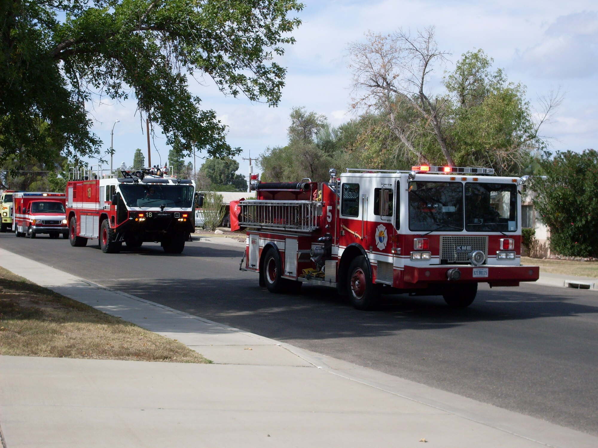 In honor of the annual National Fire Prevention Week campaign, Davis-Monthan
fire trucks participate in the parade around the base Oct. 3. Fire prevention week runs from Oct. 4 to Oct. 10 and is designated by presidential proclamation annually. The Davis-Monthan Fire Department uses fire prevention week to host local activities and events to educate the public and raise awareness of fire safety issues.  (U.S. Air
Force photo/Senior Airman Jamie L. Coggan)
