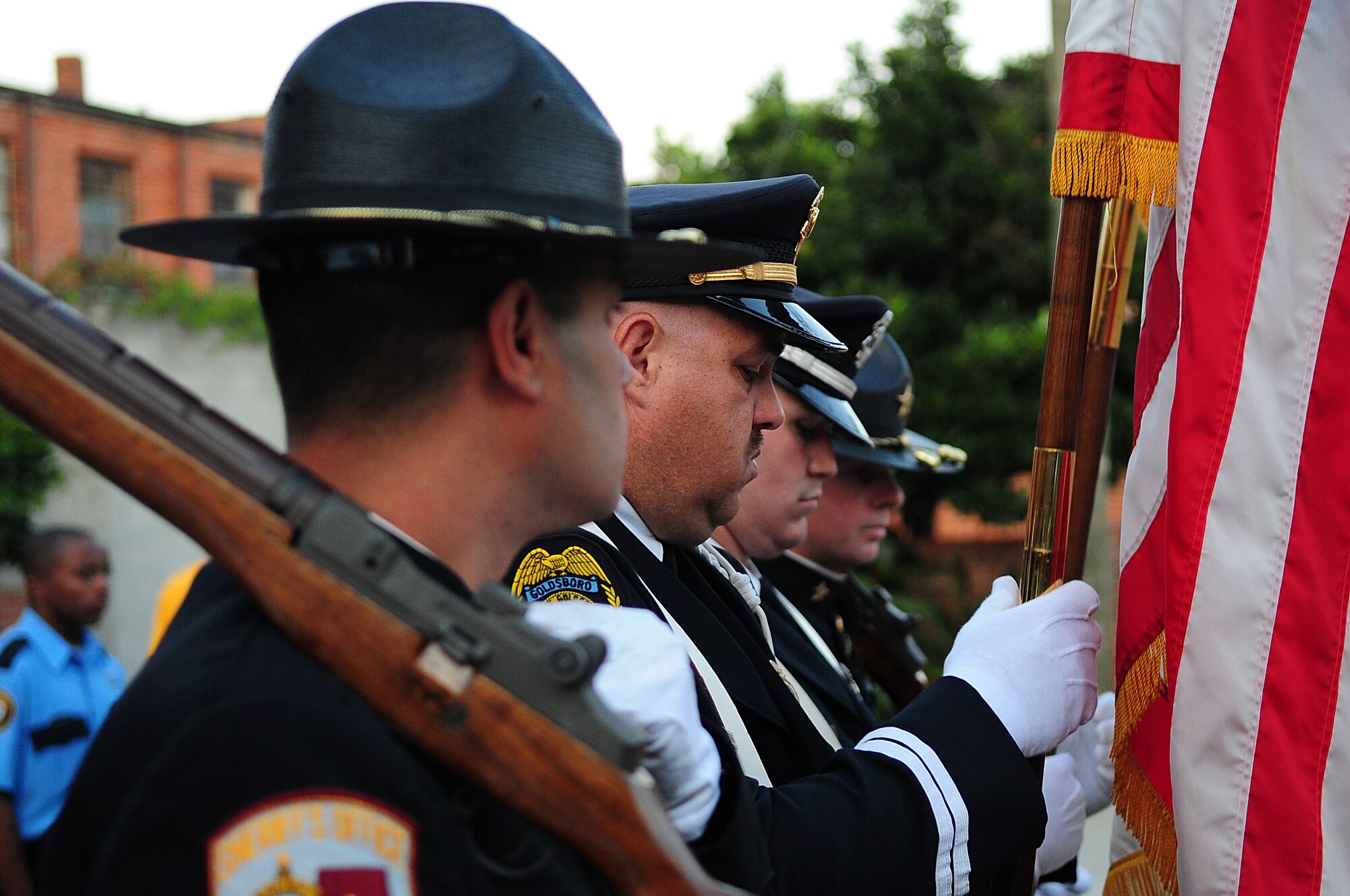 The Goldsboro Police Department color guard practices posting the colors before the Blue Ribbon Jam on Center Street in Goldsboro, N.C., Oct. 1, 2009. The color guard is comprised of four men from the department who have strong discipline. (U.S. Air Force photo/Airman 1st Class Rae Perry)