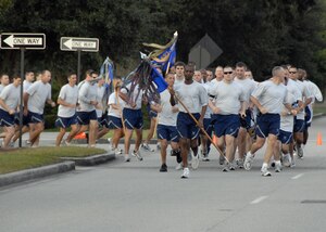 Members of the 437th Security Forces Squadron take the lead at the start of the Commander's Fitness Challenge 5K run on Hill Boulevard here Oct. 2. The fitness challenge was hosted by the 437th Operations Group. (U.S. Air Force photo/Staff Sgt. Daniel Bowles)