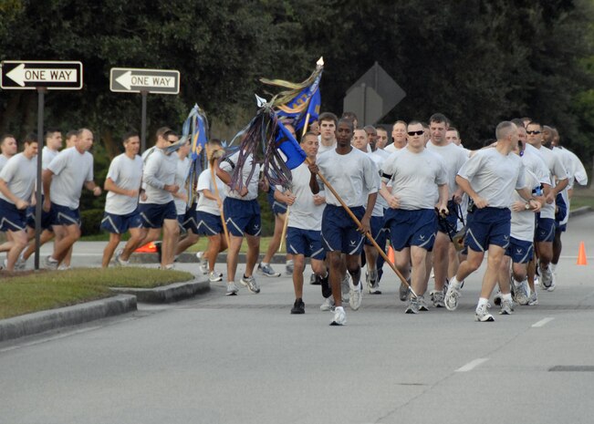 Members of the 437th Security Forces Squadron take the lead at the start of the Commander's Fitness Challenge 5K run on Hill Boulevard here Oct. 2. The fitness challenge was hosted by the 437th Operations Group. (U.S. Air Force photo/Staff Sgt. Daniel Bowles)
