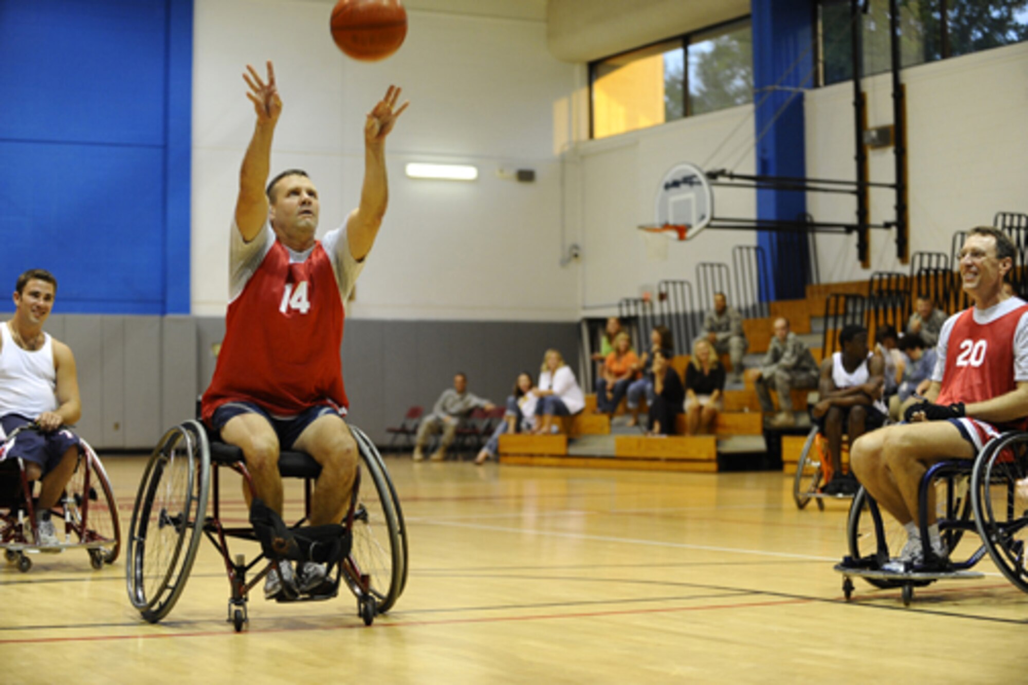 HURLBURT FIELD -- Chief Master Sgt. Oscar "Deno" Mackin, 505th Command and Control Wing command chief, takes a shot during the fourth annual Wheelchair Basketball Exhibition Game against the Mobile Patriots Oct. 1 at Aderholt Fitness Center. Every October, members of Hurlburt Field form a Commando team to take on the nonprofit basketball team to recognize National Disability Employment Awareness month. (U.S. Air Force photo by Senior Airman Julianne Showalter) 