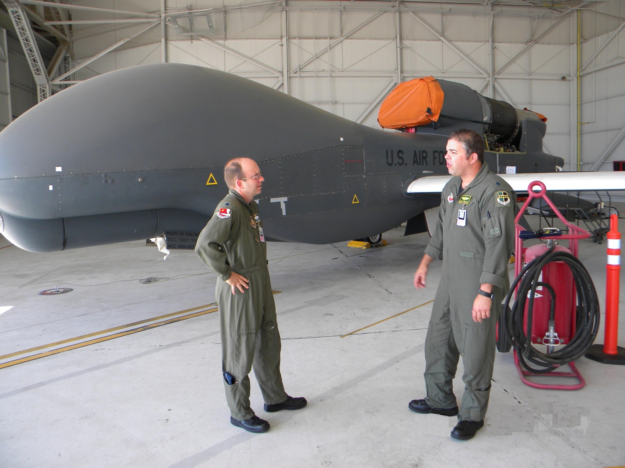 Lt. Col. Brian Dickinson 9th Reconnaissance Wing safety officer and Lt. Col. Lewis Harding 940th Wing safety officer, discuss the synergy gained from their wings' collaborative efforts. (Photo by Dana Lineback) 