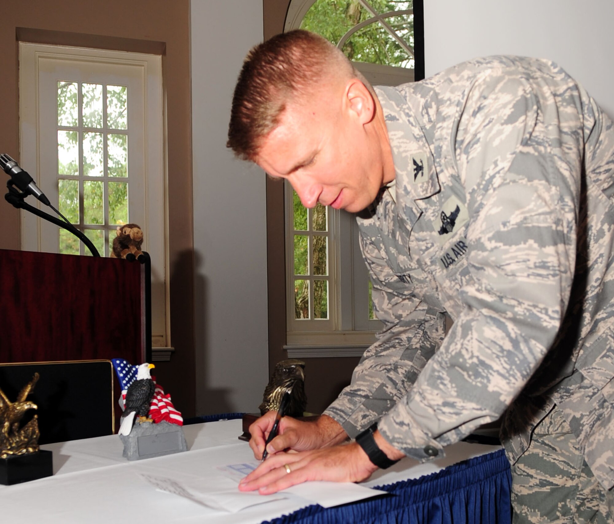 Col. Patrick Doherty, 4th Fighter Wing vice commander, signs the first donation slip for the Combined Federal Campaign kicking off this year’s campaign at Seymour Johnson Air Force Base, N.C., Oct. 6, 2009. The CFC is the world’s largest and most successful single fundraising campaign, with more than 2,500 organizations ranging from those benefiting veterans to providing scholarships for high school students. (U.S. Air Force Photo/Airman 1st Class Rae Perry)