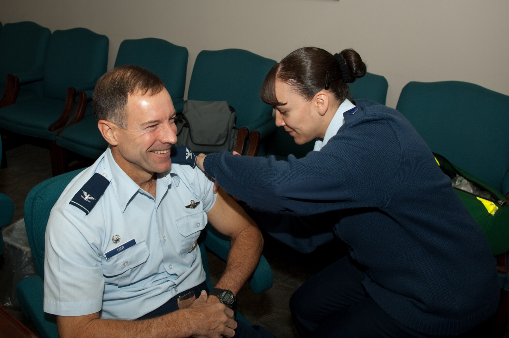 HANSCOM AIR FORCE BASE, Mass. – Col. David Orr, 66th Air Base Wing commander receives his influenza vaccine from Staff Sergeant Khalilah Velez, 66th Medical Group on Oct. 5. Vaccines are currently available for active duty personnel only. Vaccinations will be available to dependents and retirees empanelled to the Hanscom clinic upon receipt of additional supplies. For additional information call 781-377-8084. (U.S. Air Force photo by Rick Berry)