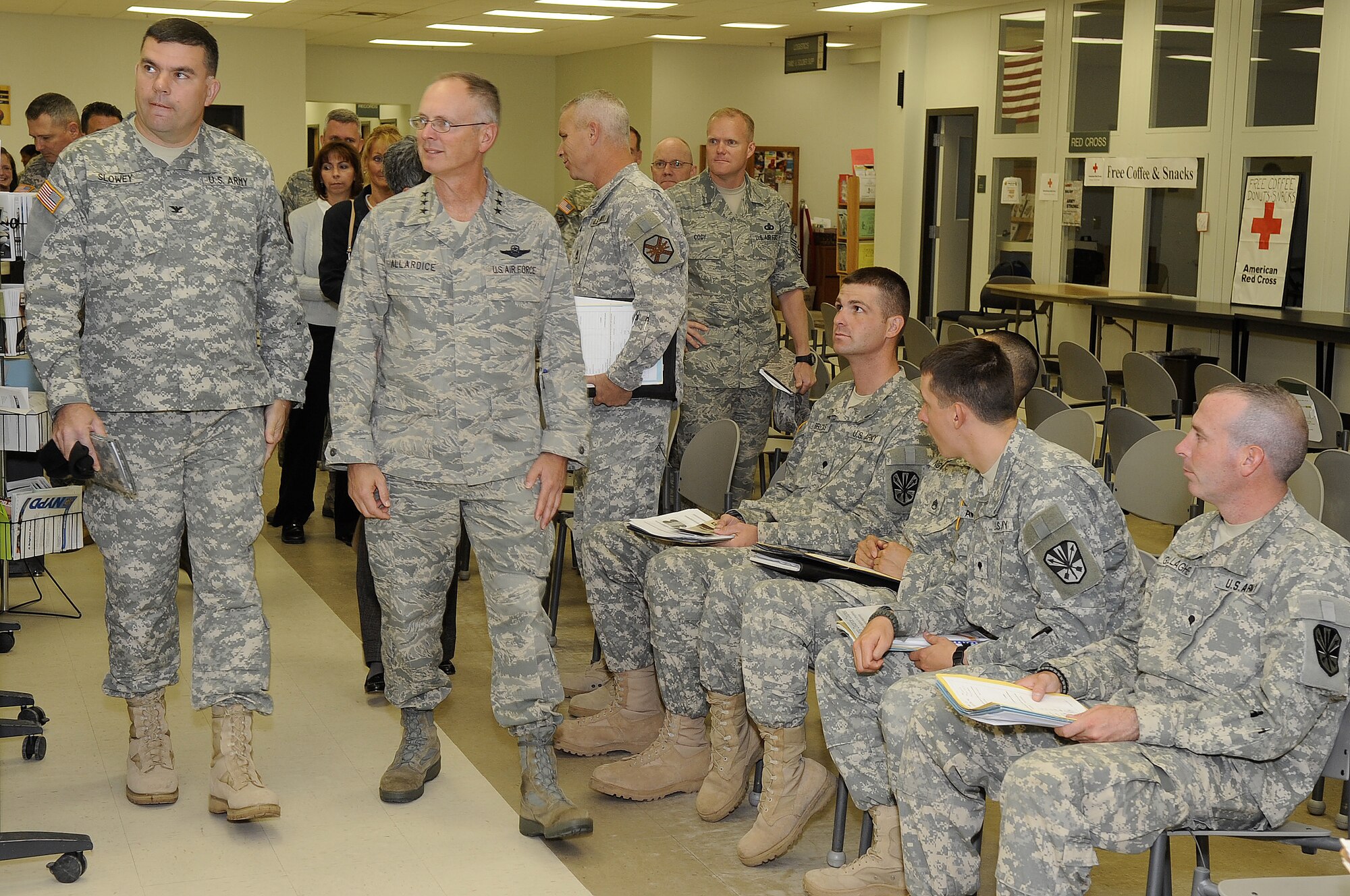 Left to right, Col. Patrick Slowey, Army Support Activity commander, and Lt. Gen. Robert Allardice, 18th Air Force and U.S. Air Force Transportation commander, listen to a briefing during a tour of the Joint Readiness Center at Dix Oct. 2 here. General Allardice was here to visit the new joint base and to be the keynote speaker at the Joint Base Dining Out. (U.S. Air Force photo/Carlos Cintron)

