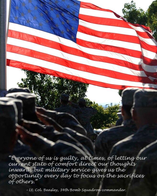 Airmen salute the American flag as it is lowered during the Prisoners of War/Missing in Action Remembrance Day retreat ceremony, Sept. 18. The entire day was dedicated to remembering servicemembers taken as prisoners of war or missing in action. (U.S. Air Force photo illustration/ Senior Airman Kasey Zickmund)