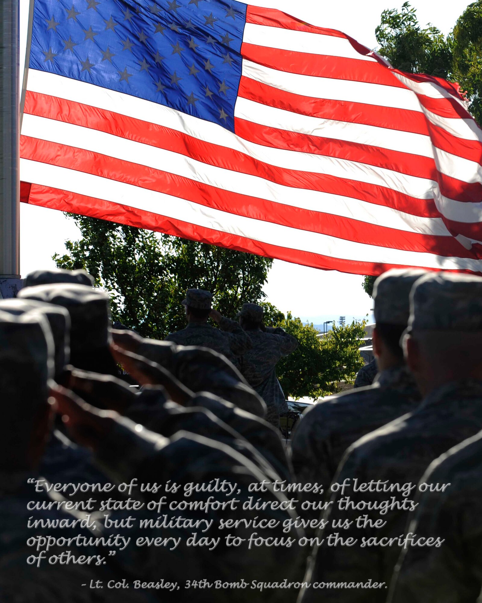 Airmen salute the American flag as it is lowered during the Prisoners of War/Missing in Action Remembrance Day retreat ceremony, Sept. 18. The entire day was dedicated to remembering servicemembers taken as prisoners of war or missing in action. (U.S. Air Force photo illustration/ Senior Airman Kasey Zickmund)