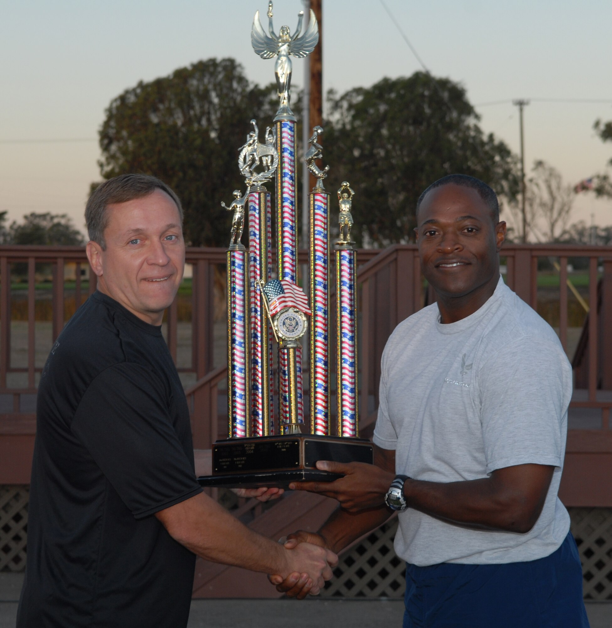 VANDENBERG AIR FORCE BASE, Calif. -- The 30th Launch Group comes out on top. Col. Lavanson Coffey, the 30th LCG commander, accepts the Commander's Trophy for intramural sports during the September Wing Run. The Commander's Trophy is awarded to the squadron that scores the most points based on participation and performance in intramural sports. (U.S. Air Force photo/Senior Airman Antionette Lyons)
