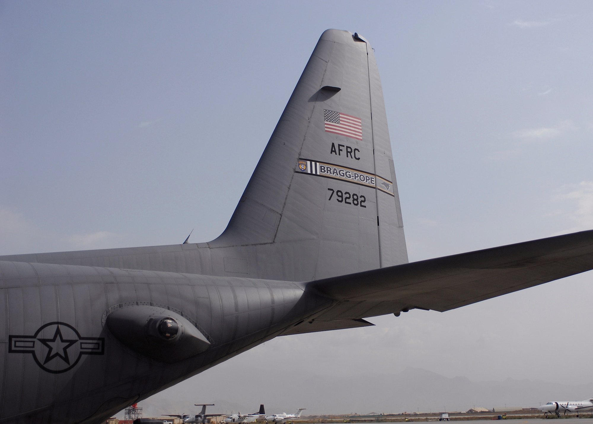 C-130 Hercules tail number 79282 from the 440th Airlift Wing at Pope Air Force Base, N.C., was dedicated to the Army's 82nd Airborne in honor of the cohesion of the Air Force and the Army in Afghanistan, Oct. 5, 2009, at Bagram Airfield, Afghanistan. The plane sports "Bragg-Pope" on its tail flash representing the close relationship between the Fort Bragg, N.C. and Pope AFB. (U.S. Air Force photo/Senior Airman Felicia Juenke) 

