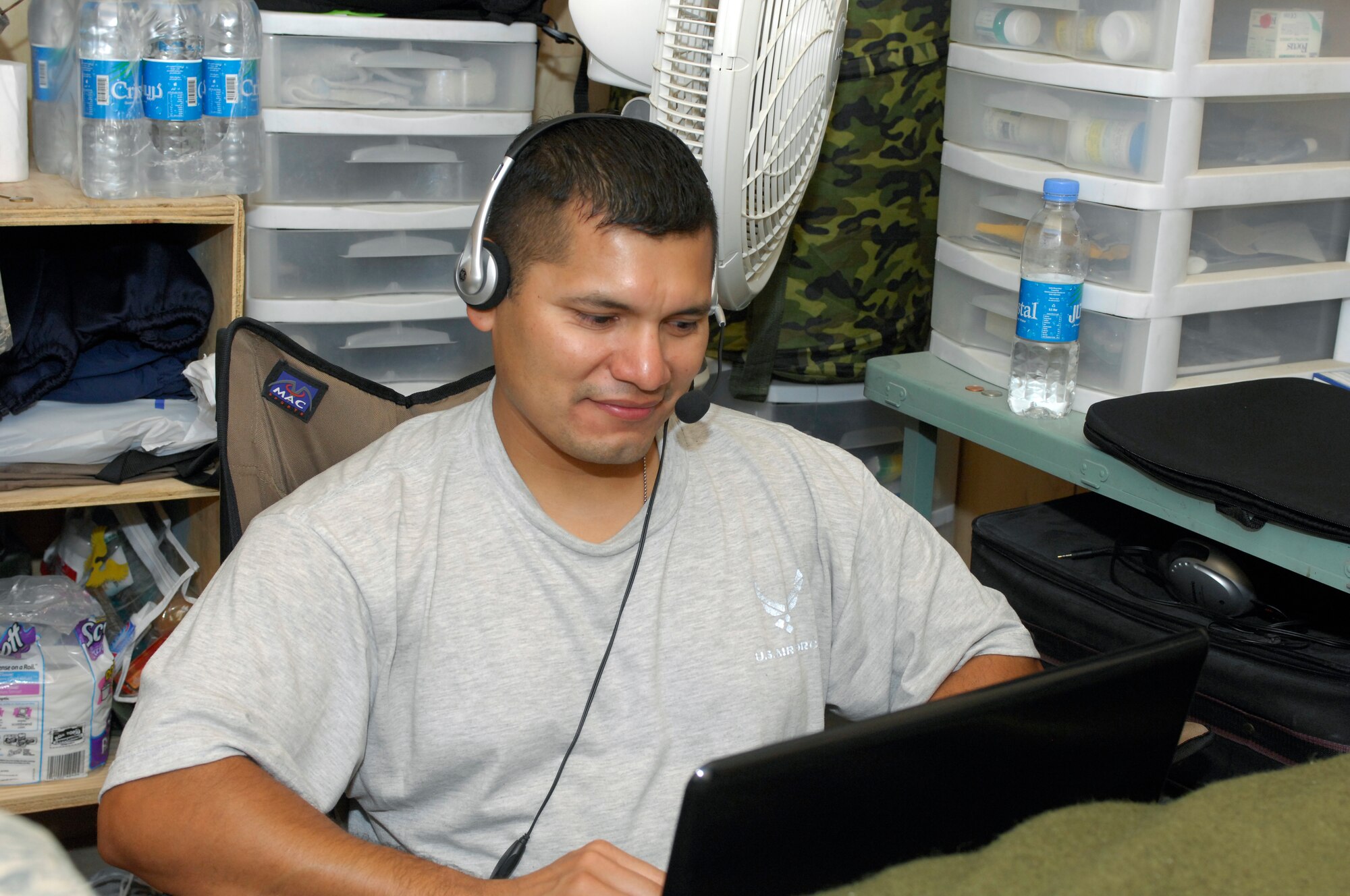 Staff Sgt. Juan Gutierrez uses his computer to conduct a video chat with his children while deployed Sept. 26, 2009, at Bagram Airfield, Afghanistan. Sergeant Gutierrez is currently serving as the dental clinic NCO in charge for Task Force Medical at Bagram Airfield, Afghanistan. (U.S. Air Force photo/Tech. Sgt. John Jung) 