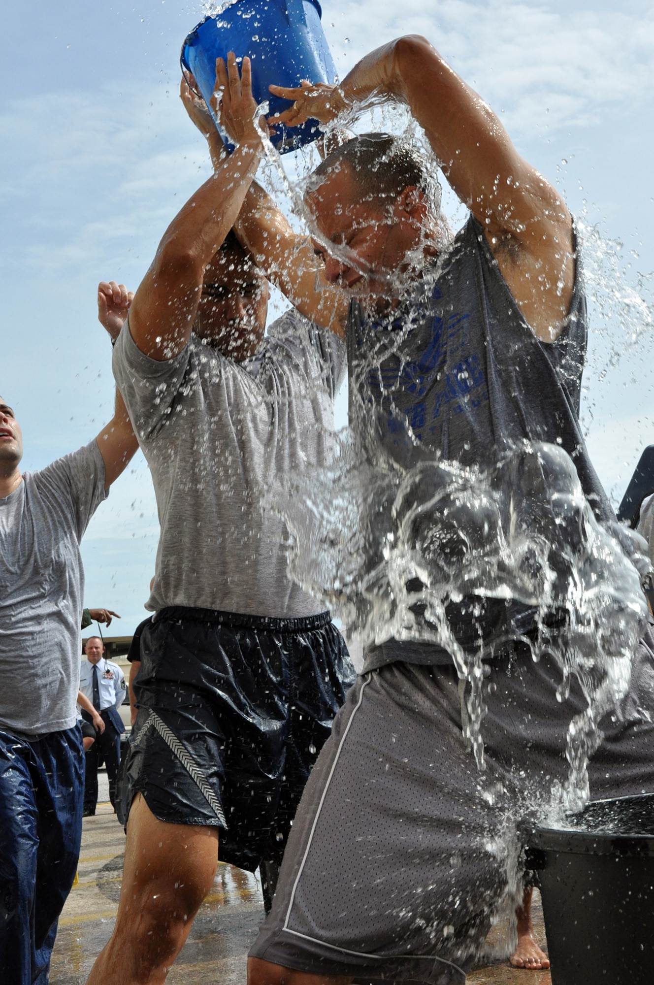 EGLIN AIR FORCE BASE, Fla. – Airmen get soaked competing in the bucket brigade challenge during the Fire Muster Challenge, Oct, 5. The event gave Airmen a chance to have fun while gaining an appreciation for the firefighter experiences. The Commanders vs. First Sergeants Challenge and the Commander’s Challenge, hosted the same day, kicked off Fire Prevention Week. (U.S. Air Force photo/ Airman Anthony Jennings)