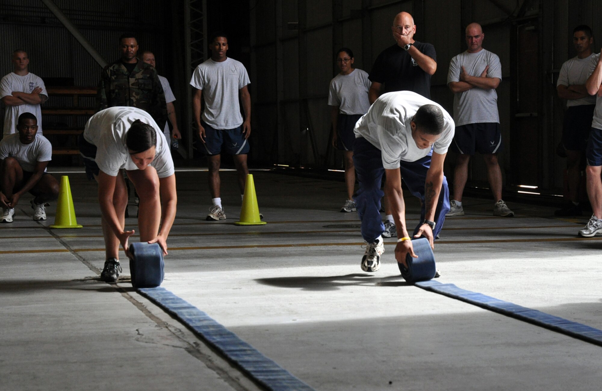 EGLIN AIR FORCE BASE, Fla. -- Airmen compete in a three-inch hose roll relay during the Fire Muster Challenge, Oct, 5. The event gave Airmen a chance to have fun while gaining an appreciation for the firefighter experiences. The Commanders vs. First Sergeants Challenge and the Commander’s Challenge, hosted the same day, kicked off Fire Prevention Week. (U.S. Air Force photo/ Airman Anthony Jennings)